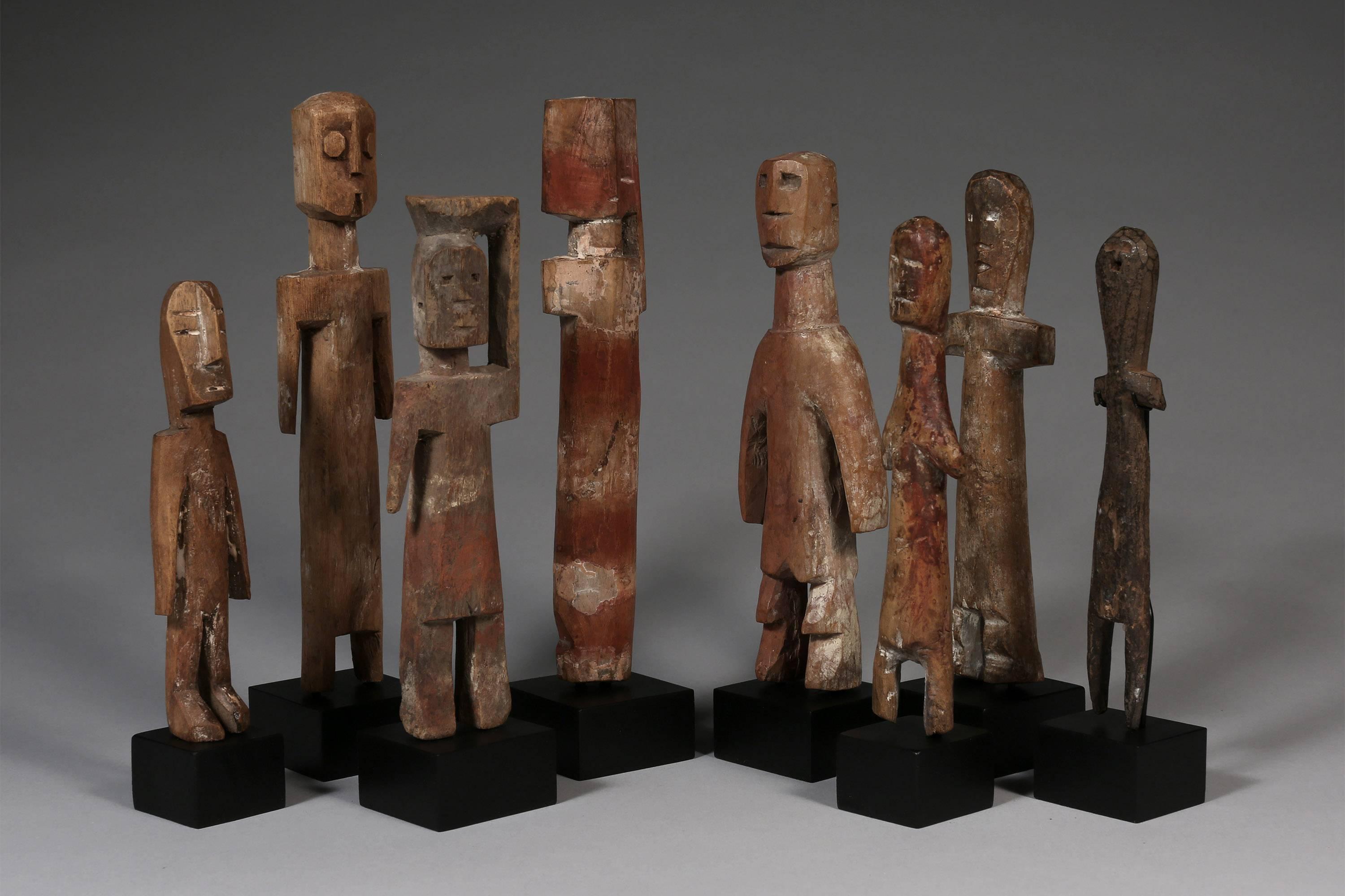 20th century eight doll like ancestor figure sculptures Adan culture Ghana Africa

A collection of eight hand-carved, wooden figures with natural pigments and individually based. Each with it's own character and form. The group of figures create a