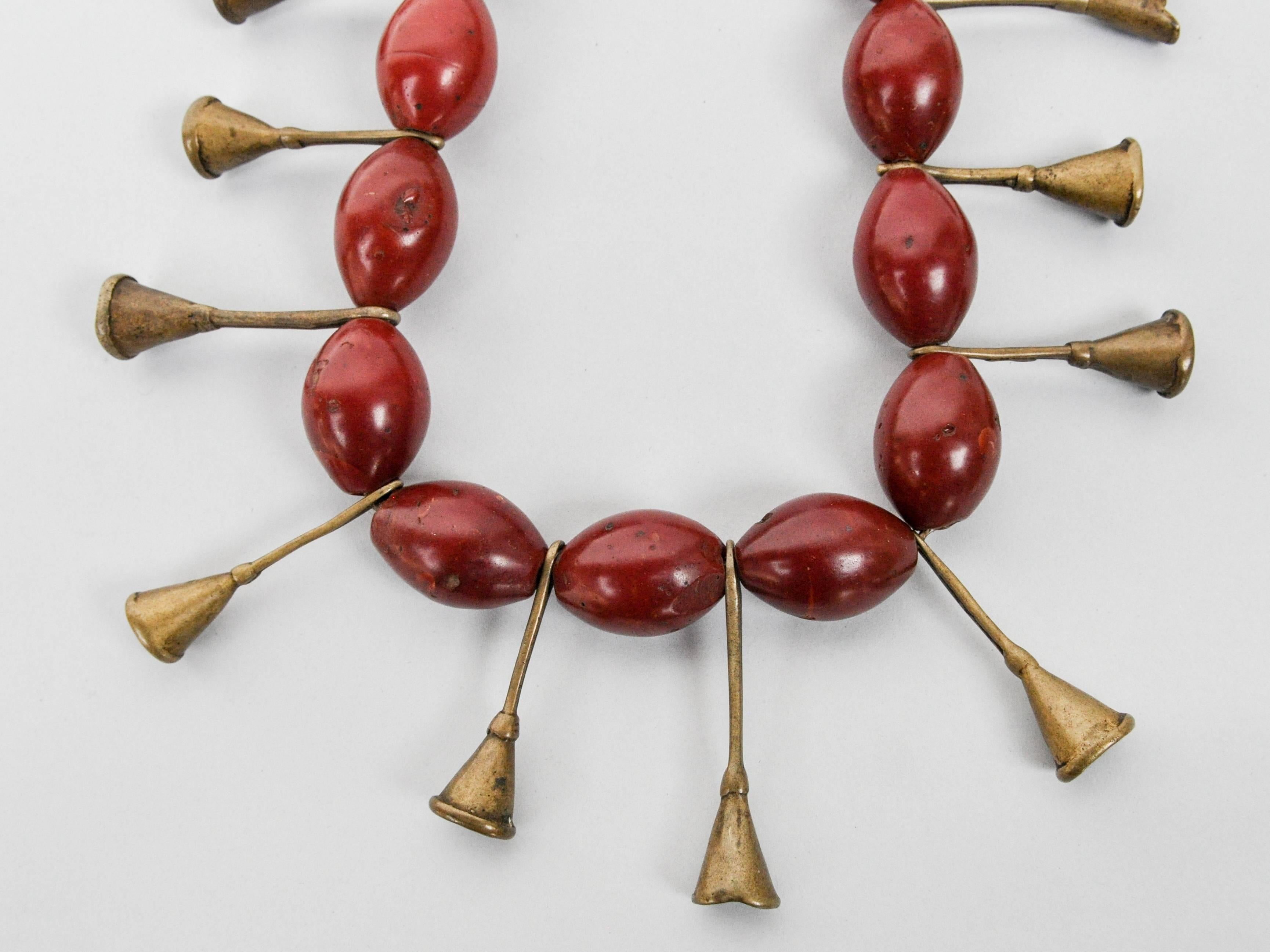 Ao Naga tribal glass and brass trumpet bead necklace early to mid-20th century
Offered by Bruce Hughes.
Tribal glass bead and brass trumpet bead necklace from the Ao Naga Tribe of Burma, early to mid-20th century. The piece comprises 17 oblong glass