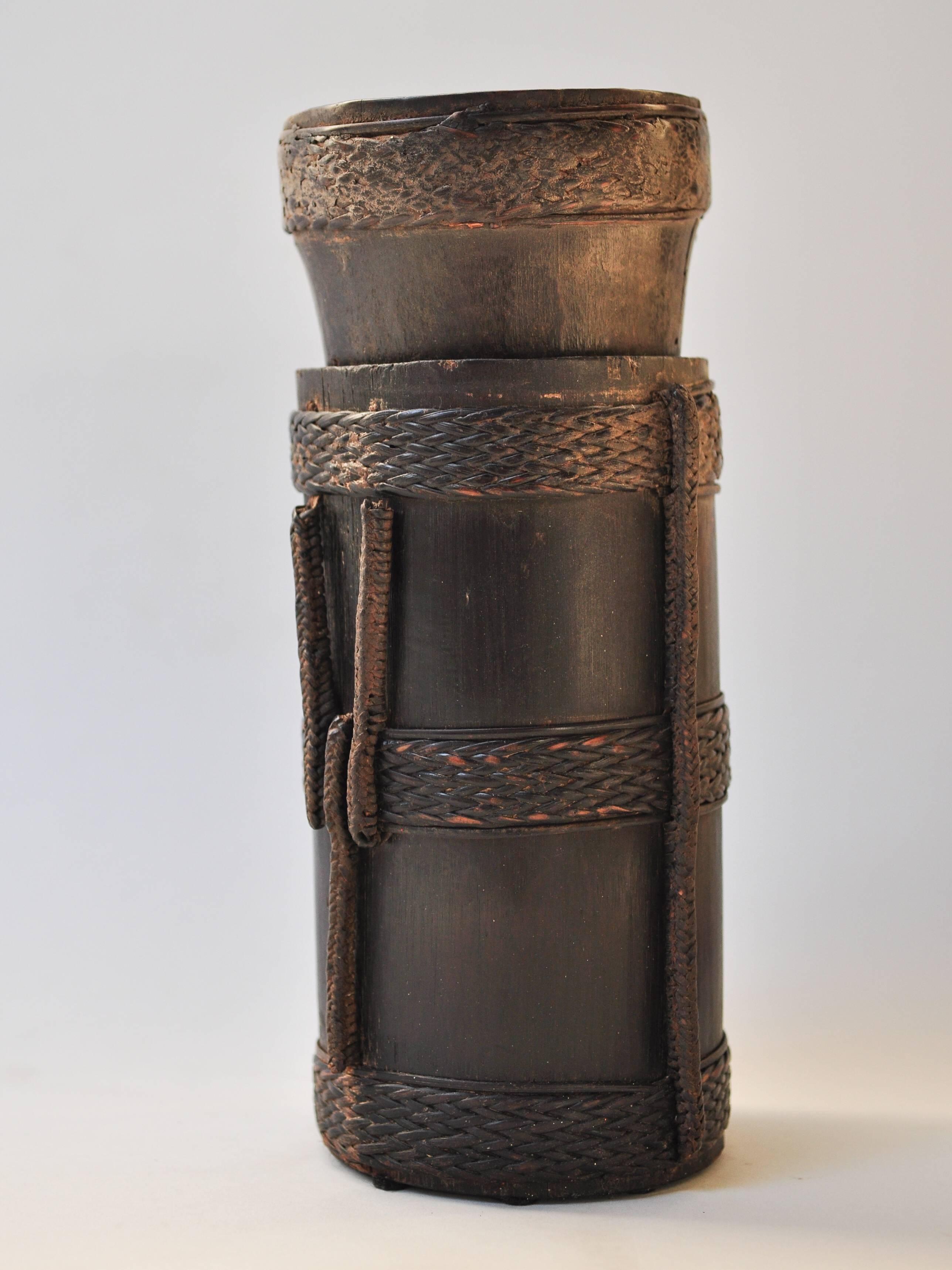Bamboo container from Nepal with rattan detailing, mid-late 20th century.
Hand fashioned bamboo container from the Nepal with braided rattan and bamboo decoration. It comes from the high mountains of the Tibet Nepal borderland and dates to circa