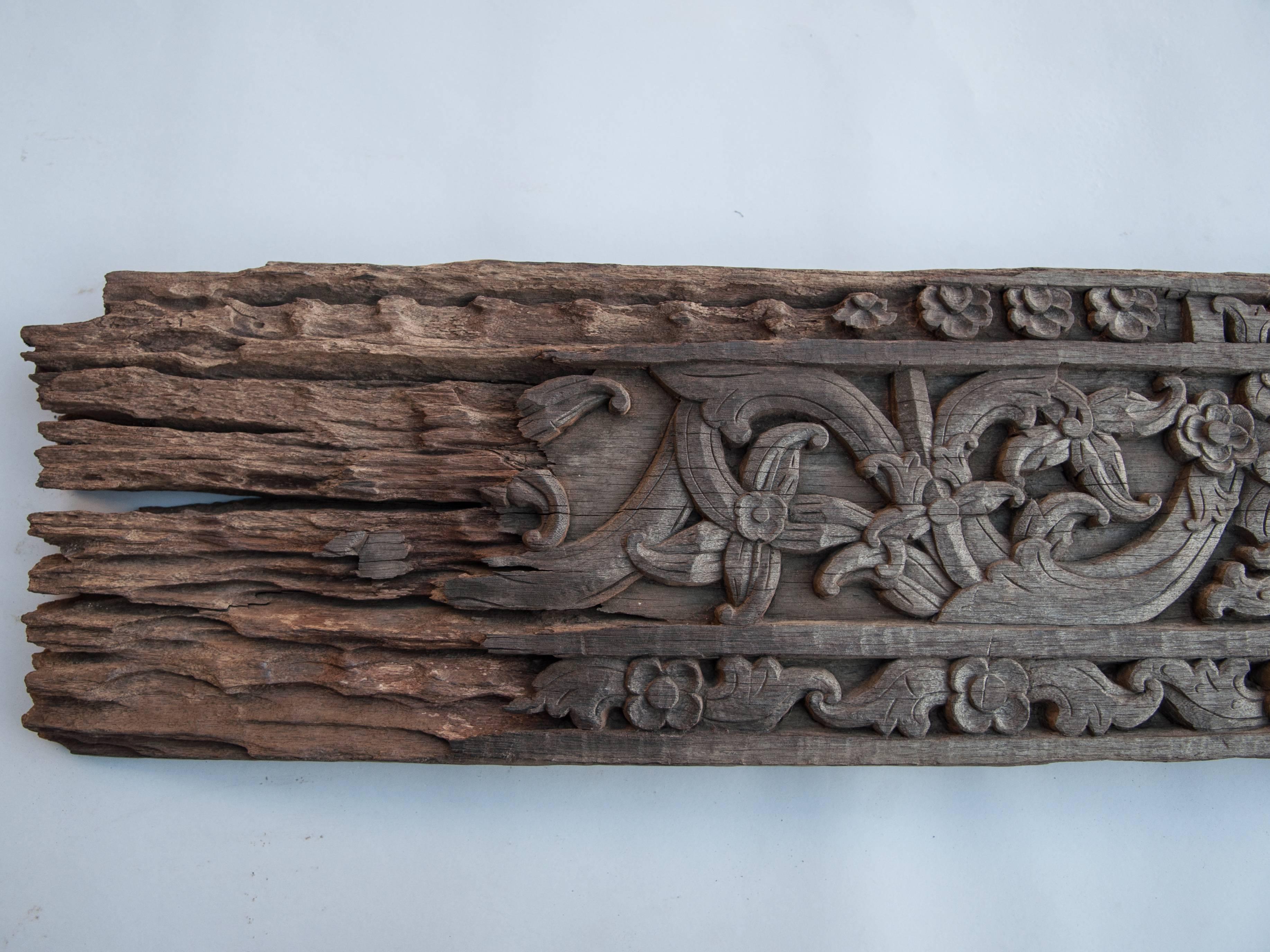 Carved ironwood panel with floral motif. Borneo, mid-20th century.
This beautifully eroded decorative panel incorporates a floral motif and comes from a Dayak longhouse in Borneo.
Dimensions: 55 inches long by 10.75 inches tall by 2 inches thick.