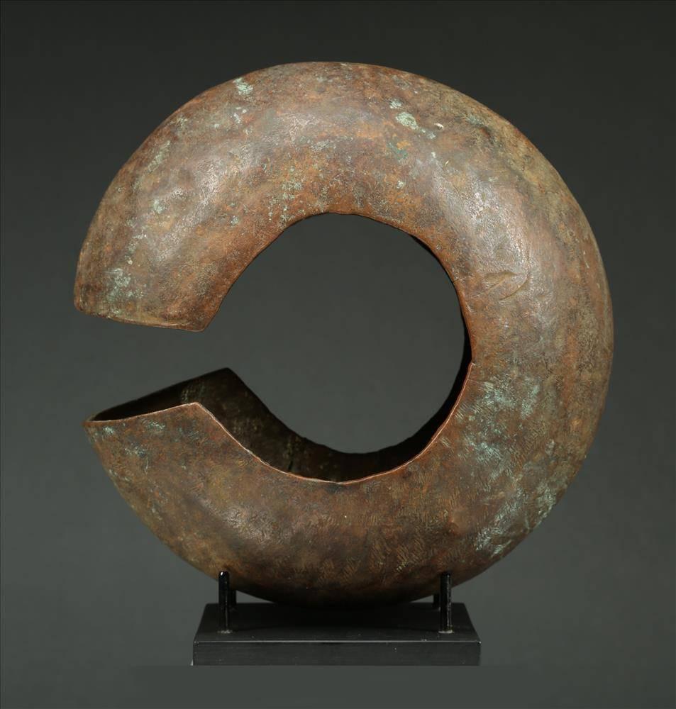 Offered by Scott McCue
Solid copper early 20th century tribal Mbole Currency, Africa, Congo 

Large copper currency piece from the Mbole in the Democratic Republic of Congo, in a large hollow form similar to anklets worn by women at the end of the