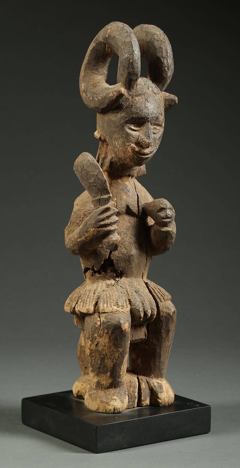 Nigerian Igbo Tribal Seated Ikenga Figure with Sword and Head Africa, Nigeria