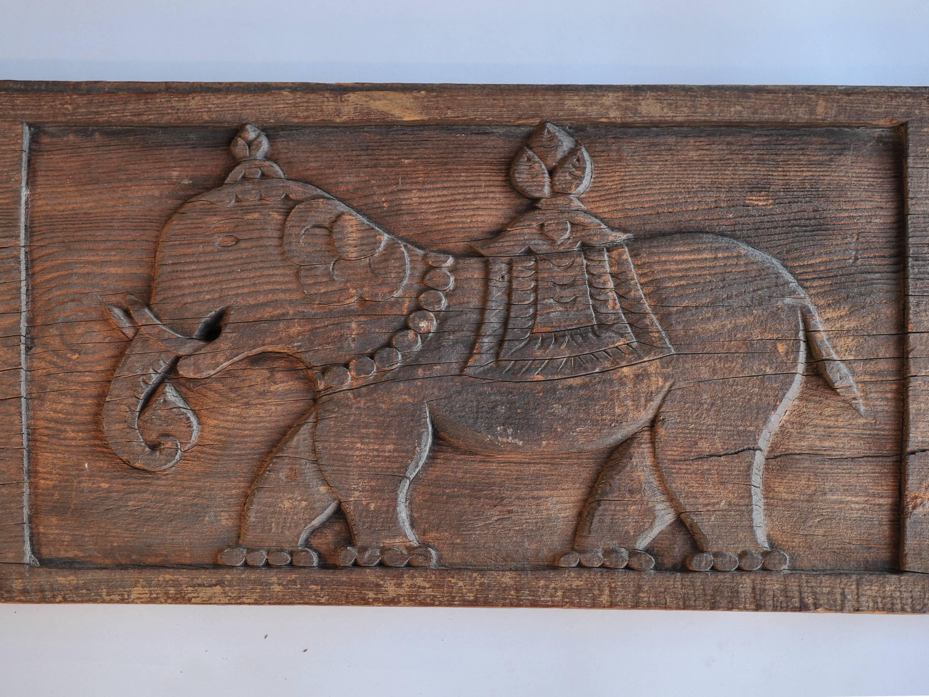 Carved Tibet architectural panel elephant and bird motifs early to mid-20th century.
This charming panel, carved from a plank of pine wood, would have adorned a Tibetan home or temple. Elephants, of course, are widely loved and regarded as highly