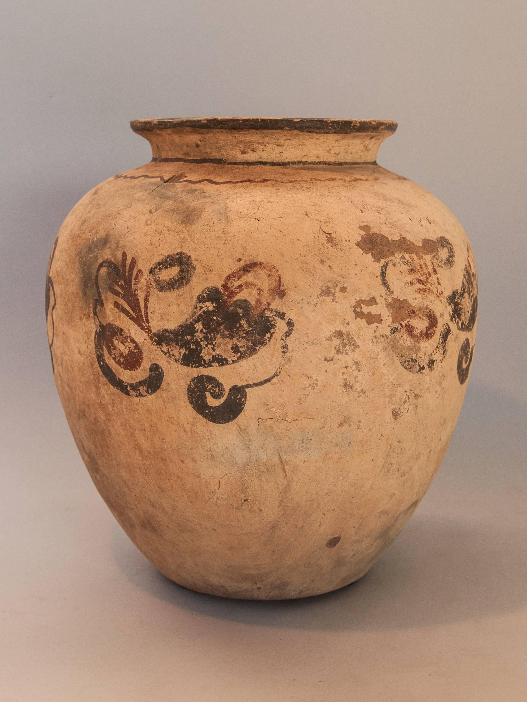 Earthenware Pot with Floral Design Mid-20th Century. Molucca Islands, Indonesia
This low fired earthenware pot is from the Southeast Molucca Islands, most probably from Kei. It is formed by hand, not thrown, using the fist and palm to achieve its