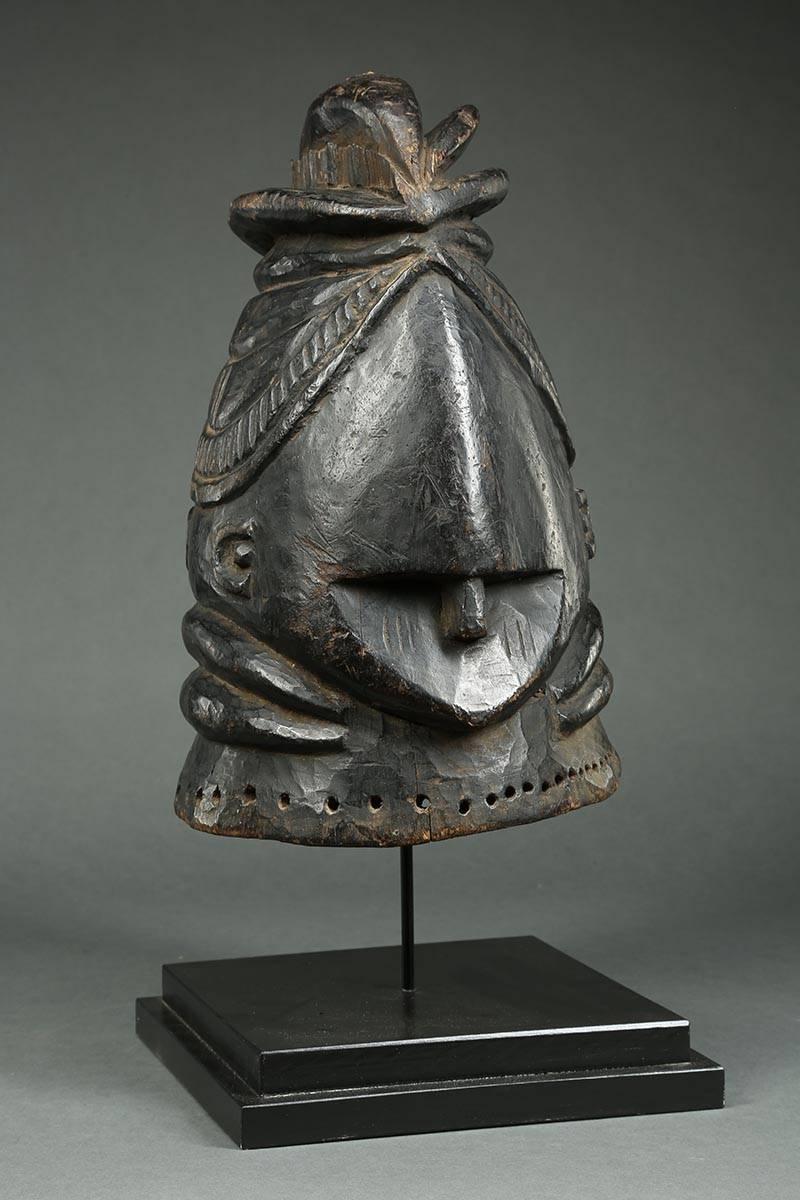 Offered by Scott McCue
Tribal African Mende Bundu Helmet Janus (Two Face) wood mask, early 20th century

Early Mende women's society Bundu Mask, with two faces, some cracks, insect damage, wear and polish outside and inside from native use. Sierra
