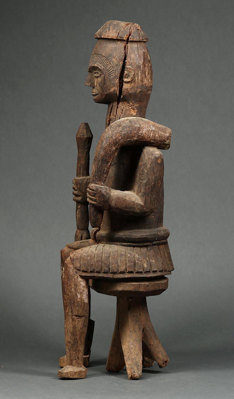 Hand-Carved Large Tribal Seated Igbo Ikenga Figure with Sword, Early 20th Century, Nigeria