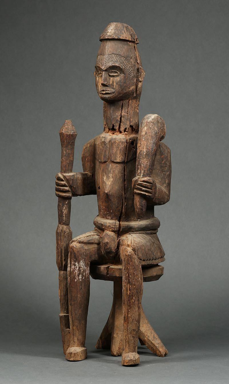 Nigerian Large Tribal Seated Igbo Ikenga Figure with Sword, Early 20th Century, Nigeria