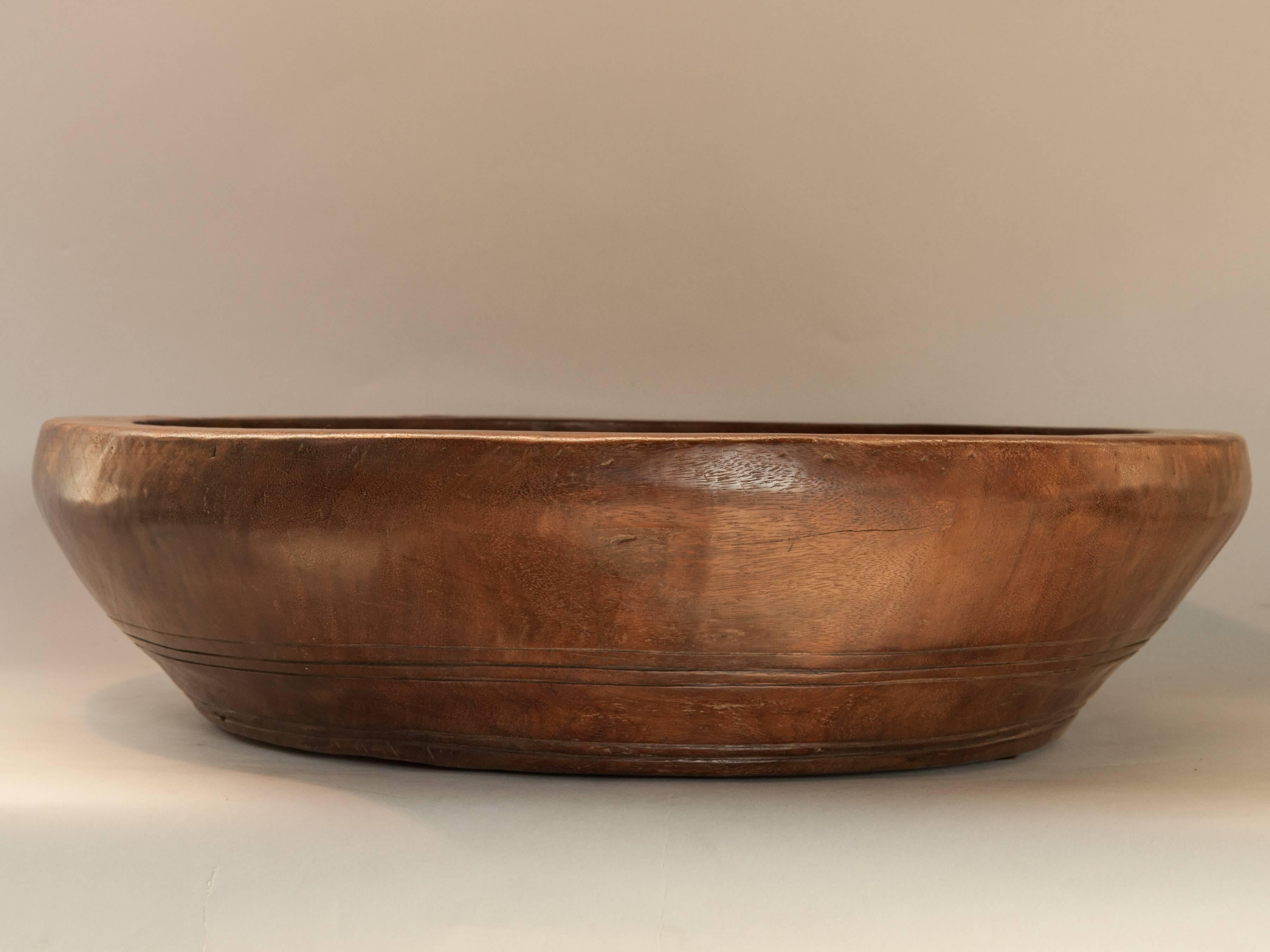 Large merbau wood rebana drum bowl. Lampung, Sumatra early-mid 20th century.
This exceptionally large bowl is made from an old wooden drum from the area of Lampung in southern Sumatra. The outer frame is fashioned from a single piece of Merbau wood;