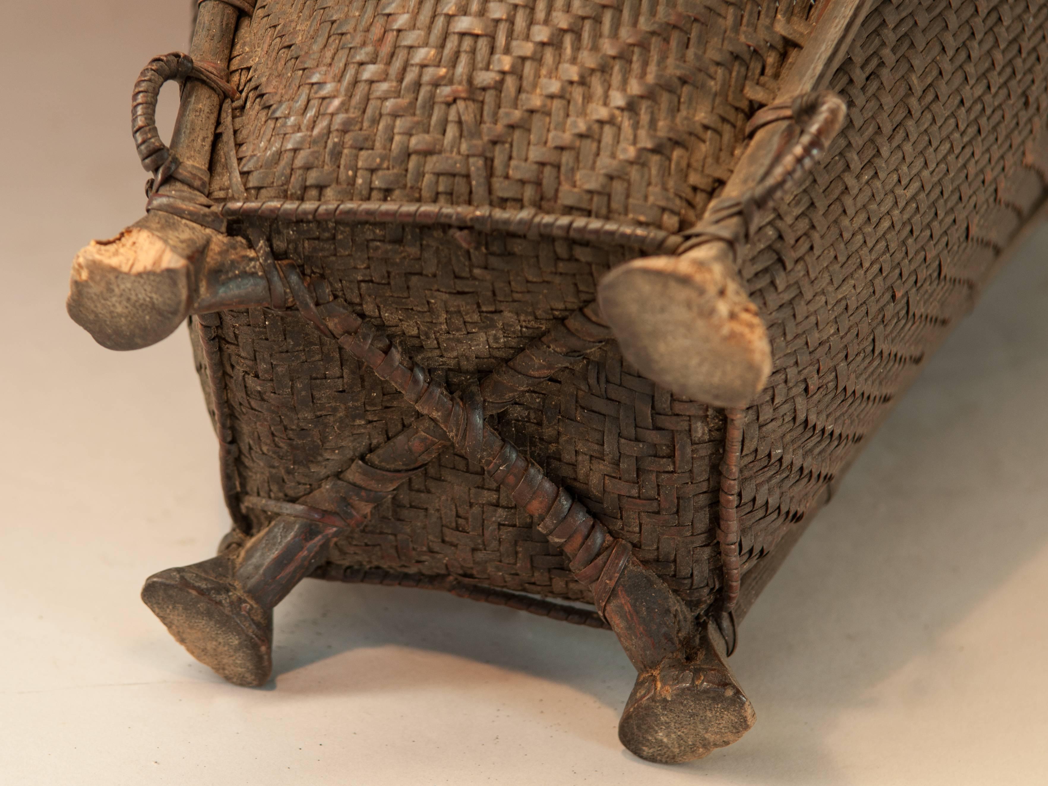 Hand-Carved Tribal Carrying Basket with Wooden Feet Naga of Ne India, Mid-20th Century