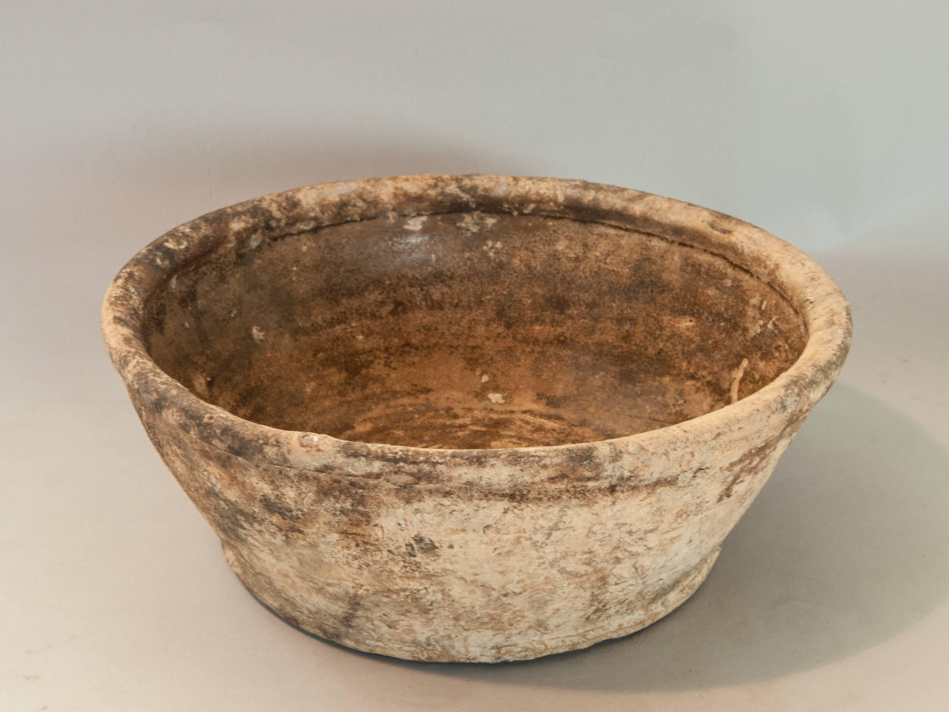 Chinese glazed ceramic bowl. Song Dynasty. Salvaged off the North Coast of Java.
This brown glazed bowl was salvaged from a shipwreck off the northern coast of Java, Exposure has led to deterioration of the glaze, and lends the piece a distinctive