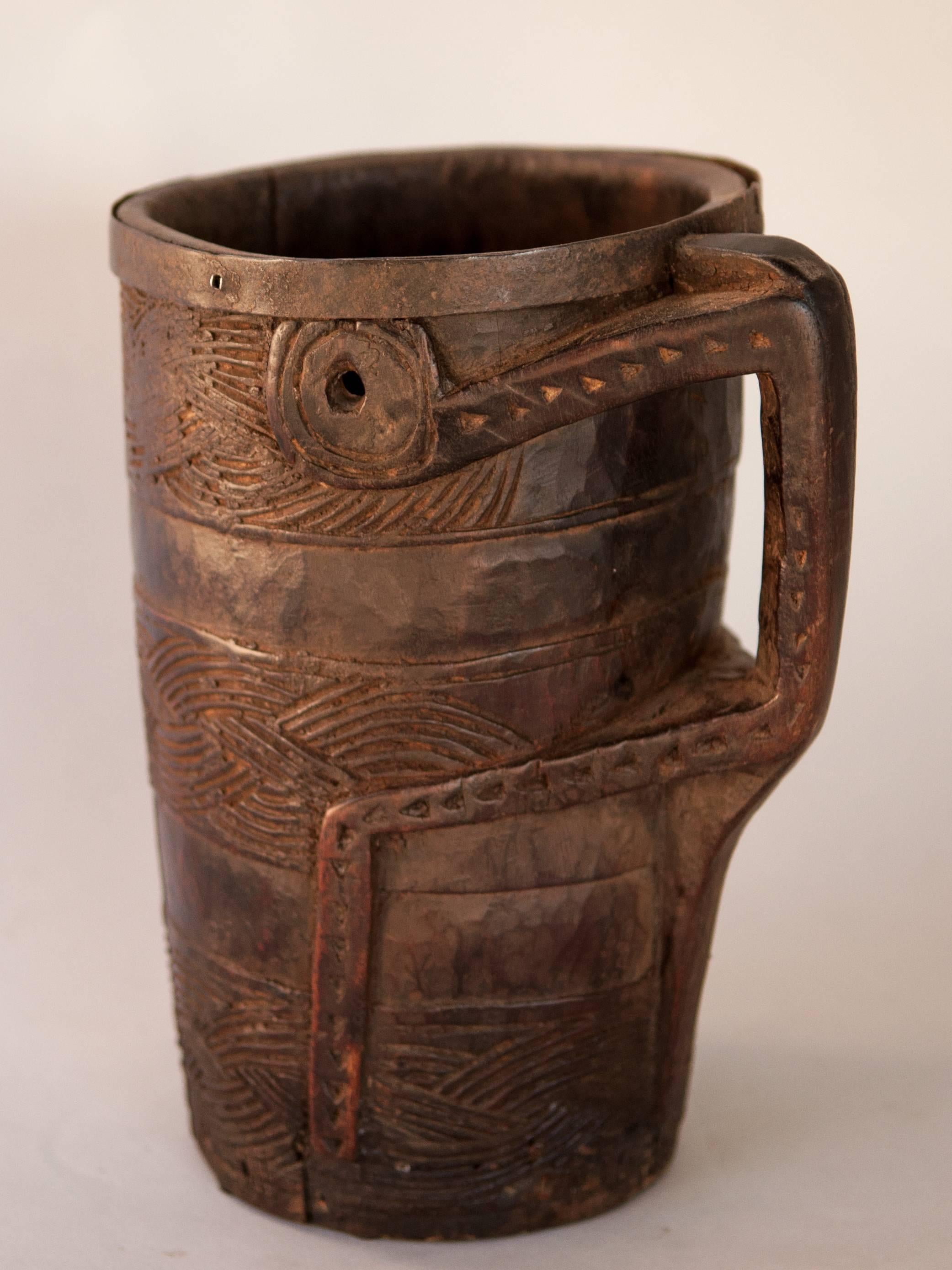 Tribal Wooden Carved Milk Pot with Stylized Monkey Motif. Late 20th Century. West Nepal