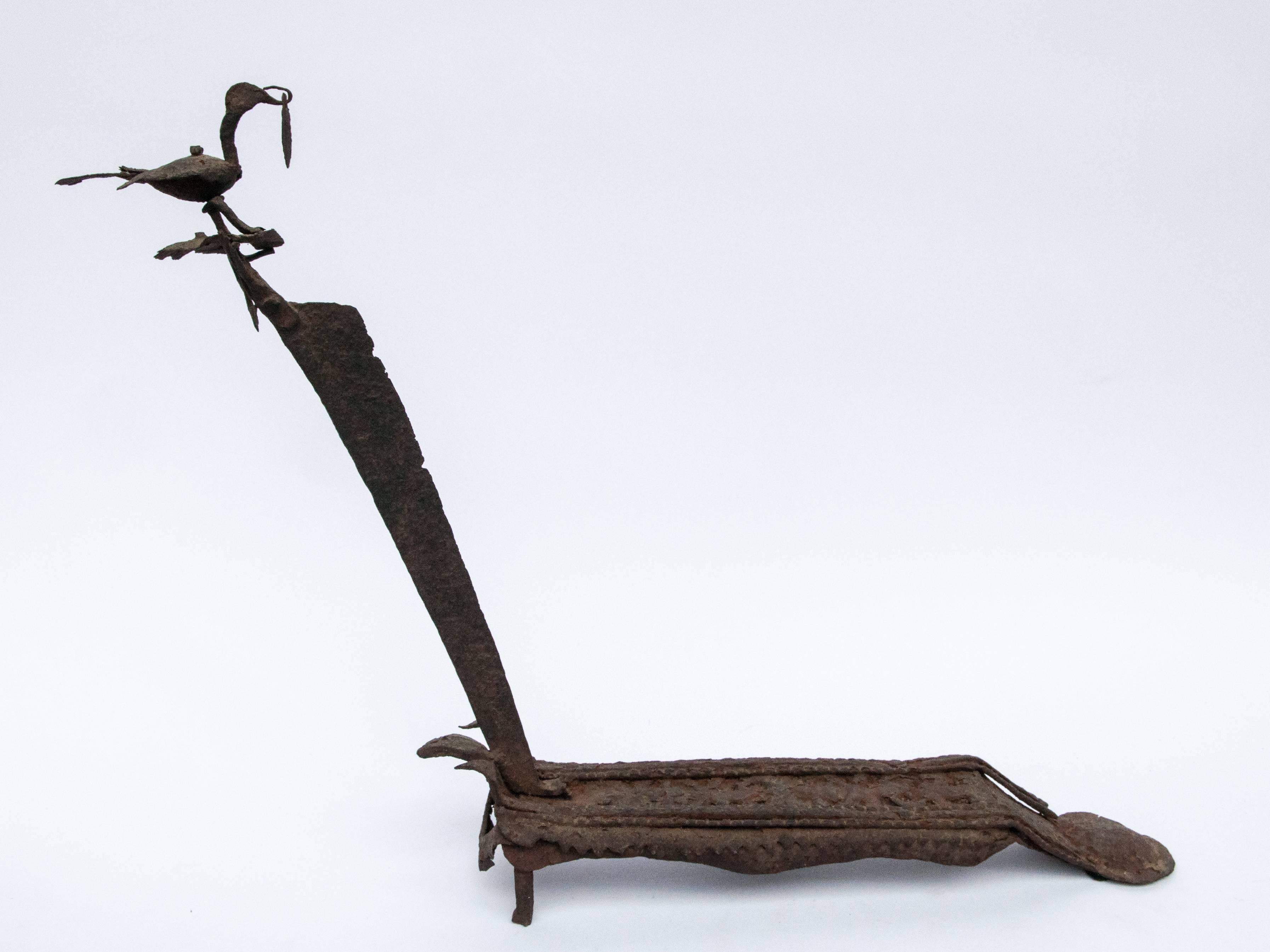 Vintage Iron vegetable cutter from Nepal, early 20th century. 
Hand fashioned by a local blacksmith working under very basic conditions, this charming tool was used in a traditional Nepali kitchen to cut vegetables. Set on the floor, foot on the