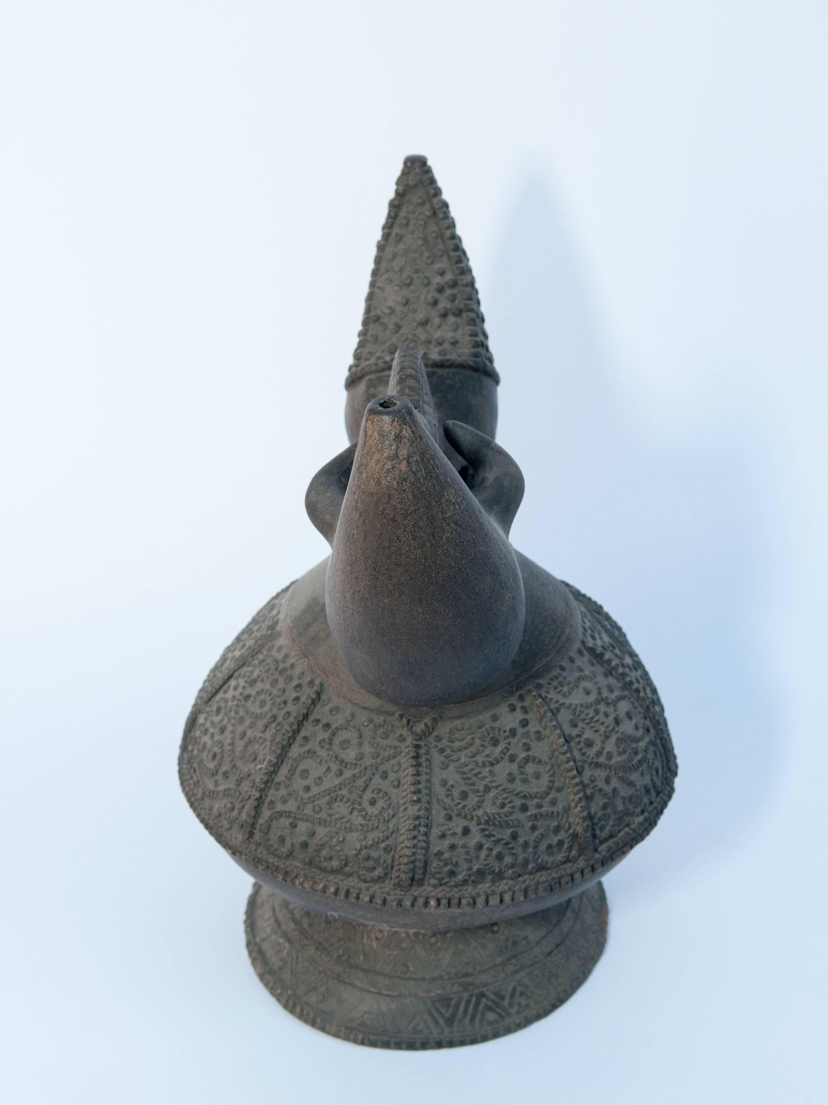 Early 20th Century Earthenware Kendi with Raised Design. Lampung Sumatra. Early to Mid-20th Century