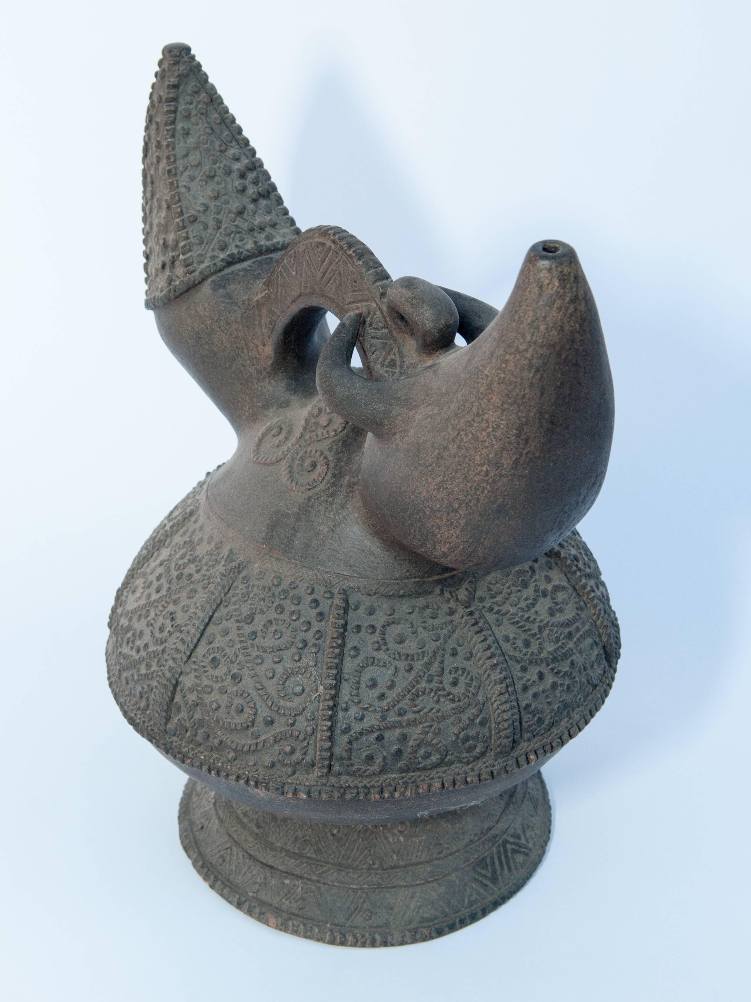 Indonesian Earthenware Kendi with Raised Design. Lampung Sumatra. Early to Mid-20th Century