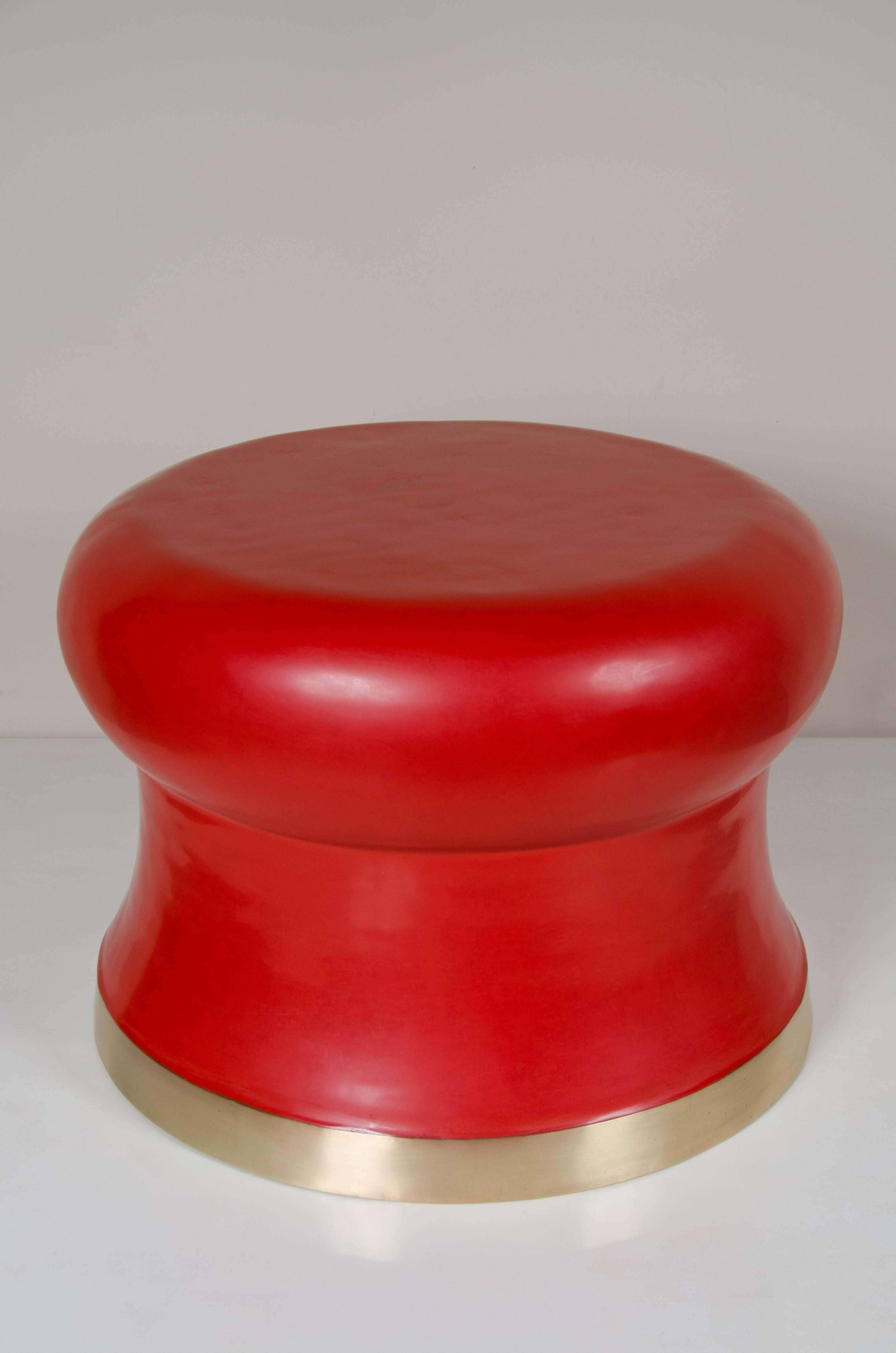 Dian drum stool.
Red lacquer.
Brass trim.
Hand Repoussé.

Lacquer is a technique that dates back to the Shang dynasty, circa 1600-1100 B.C. The pieces are made with at least 1960 coats of organic lacquer. Each layer of lacquer is applied with