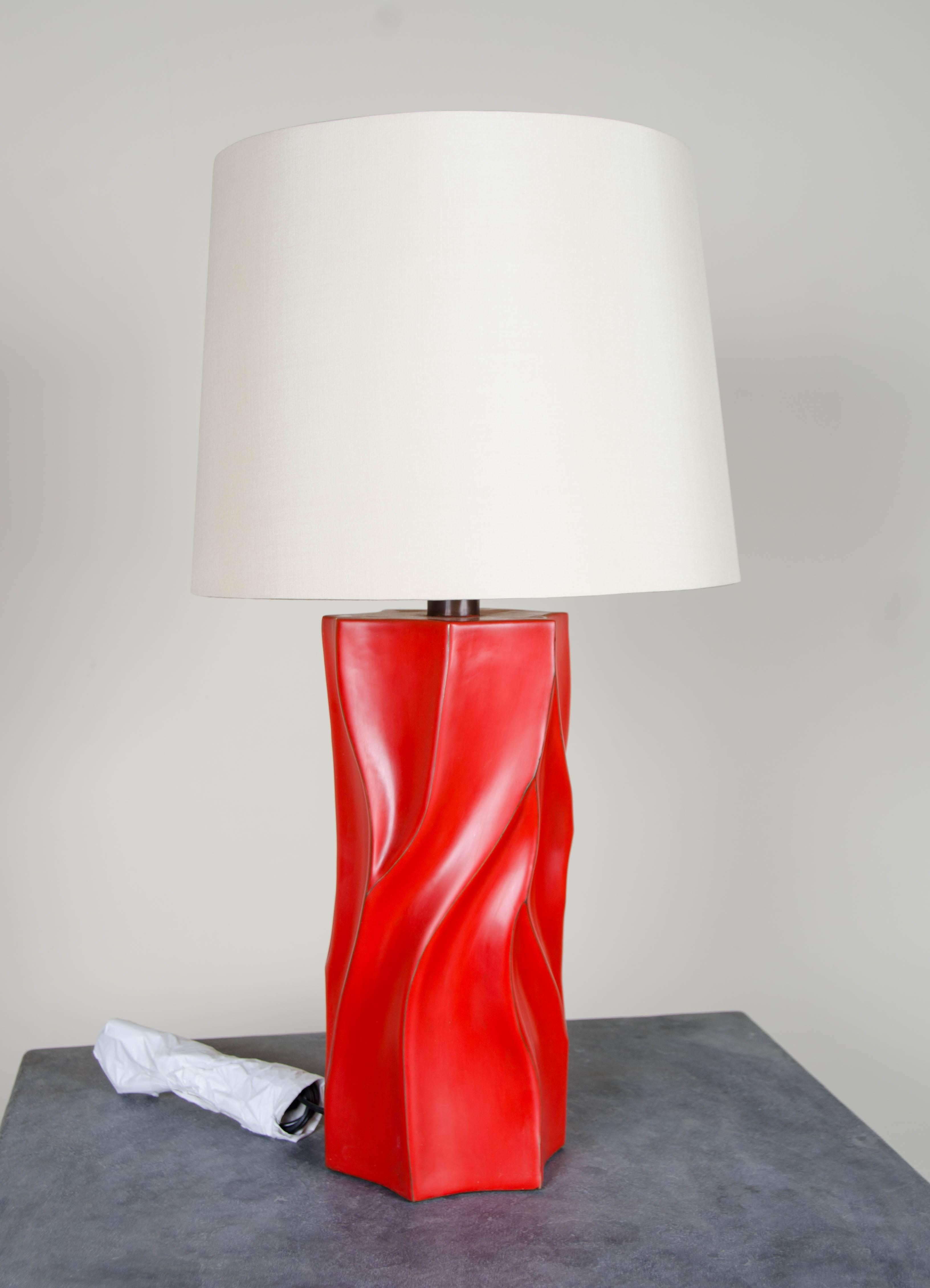 Tree trunk design table lamp
Red lacquer
Copper base
Hand repoussé
Silk shade
Limited edition

Lacquer is a technique that dates back to the Shang dynasty, circa 1600-1100 B.C. These pieces are made with at least 60 coats of organic lacquer. Each