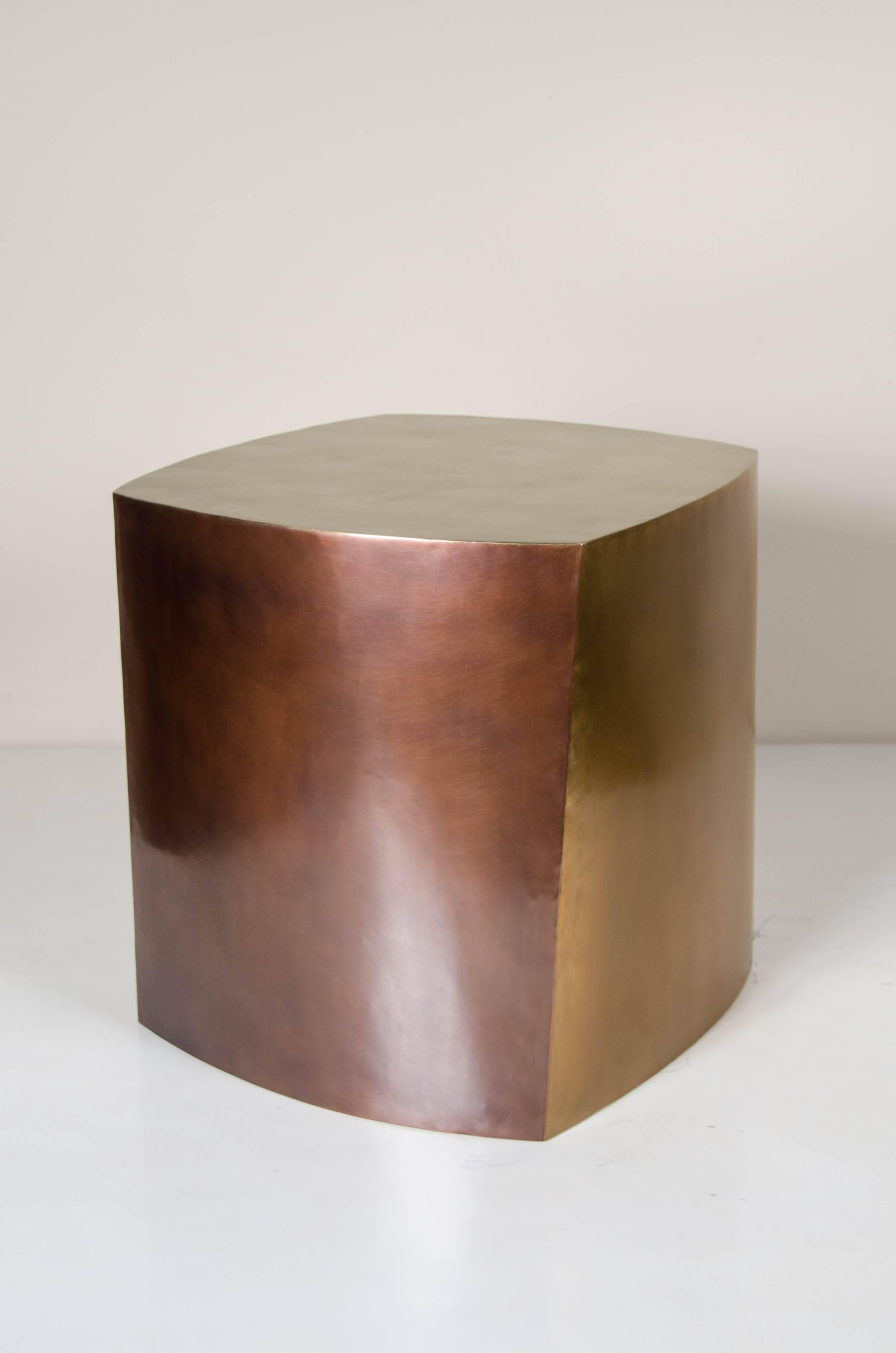 Three-tone Fang Bei drumstool.
Hand repoussé. 
Antique copper, white bronze and brass.
Contemporary.
Customizable
Limited Edition

Repoussé is the traditional art of hand-hammering decorative relief onto sheet metal. The technique originated around