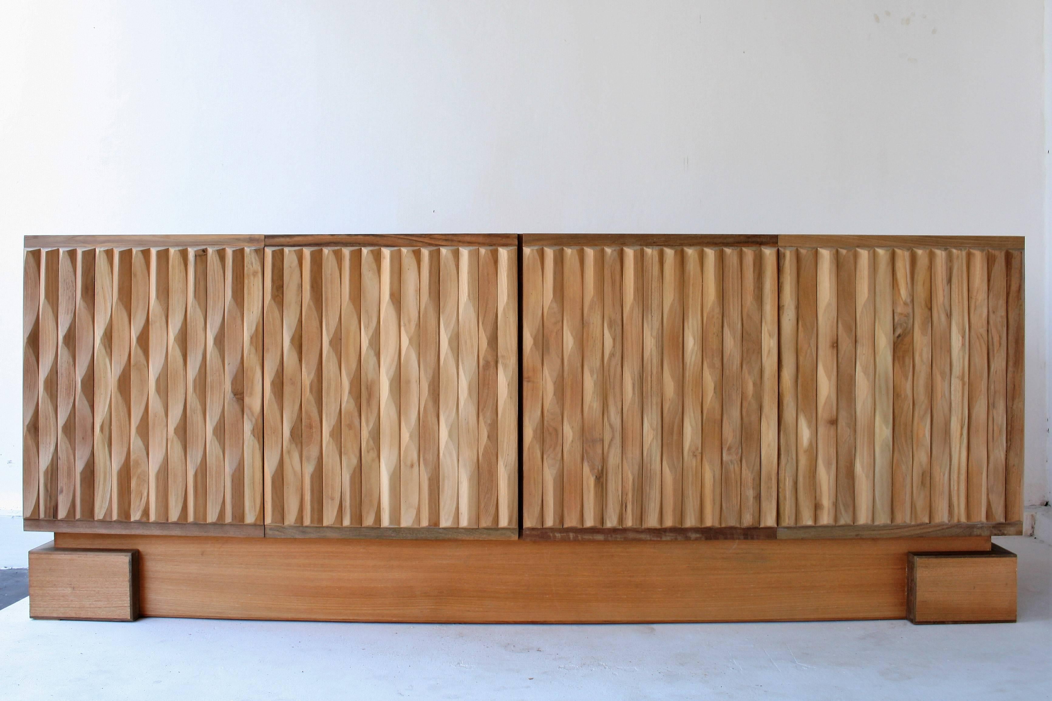 This sculptural sideboard has solid wooden graphic panels. We cleaned and stripped the doors completely and finished them with a natural oil. This cabinet looks fantastic, with only minor wear. Italian Prameta hinges.
This sideboard is a real eye