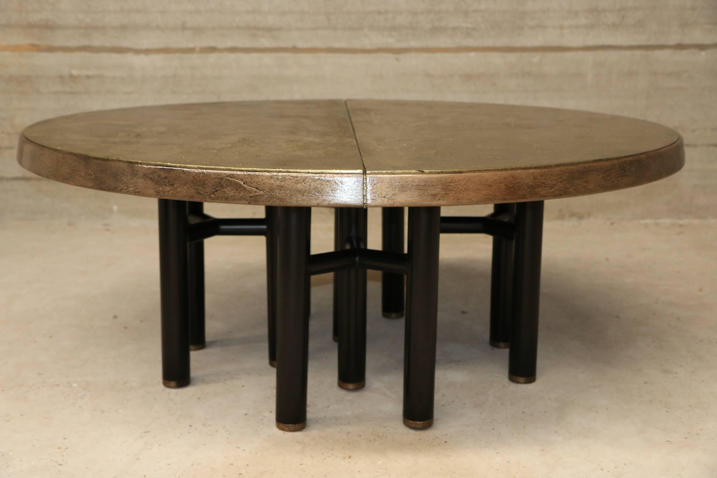 Stunning dining table by Ico Parisi for MIM, Italy. 
This table originally had black tabletop and wooden base and edging.
Funky vintage coated the two black tabletop panels with real brass layers, and the edging in a thin real bronze coating. They