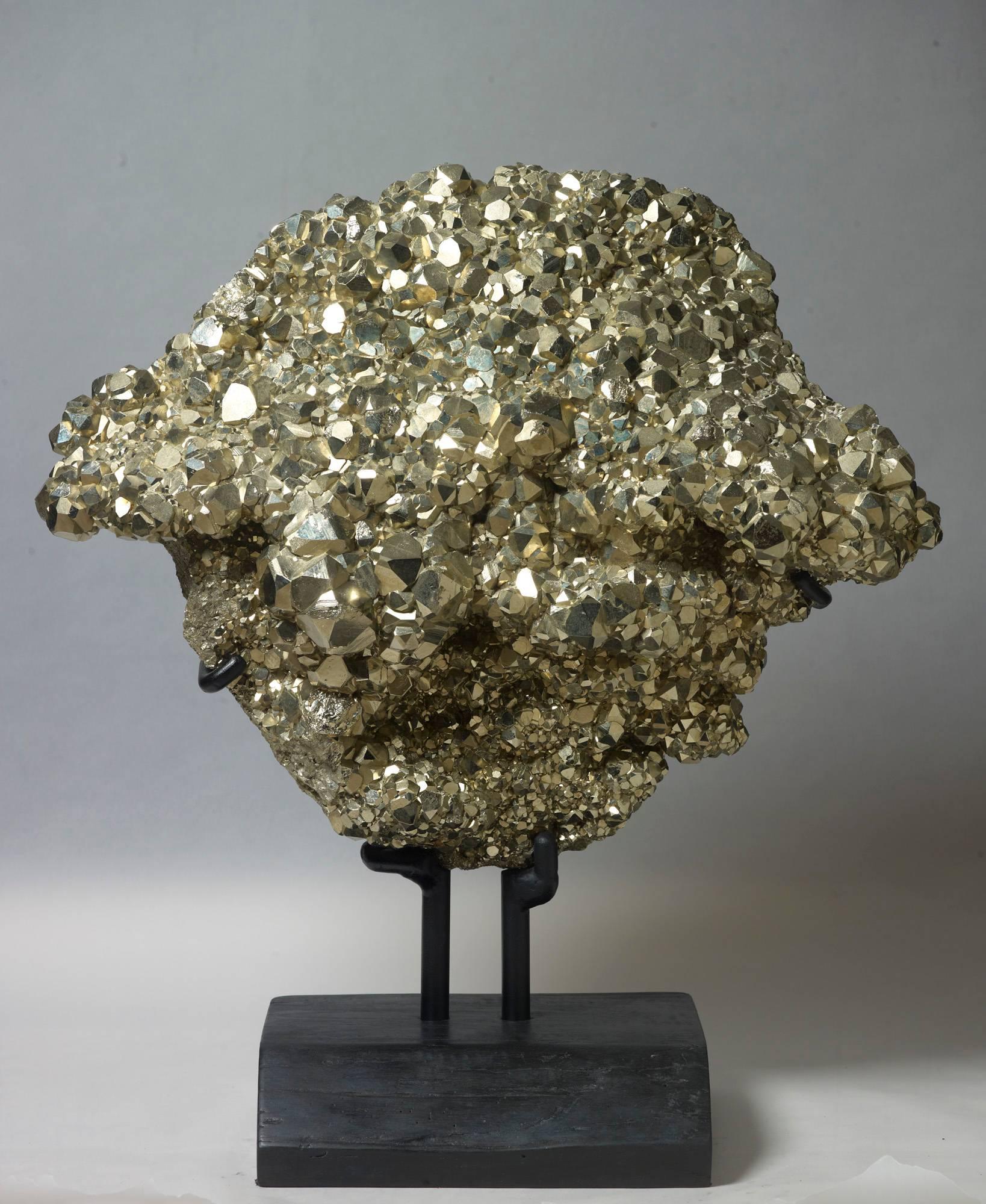 Unusually large and impressive plate of dodecahedral pyrite from Peru. Measures: 67 x 59 x 29 with stand.