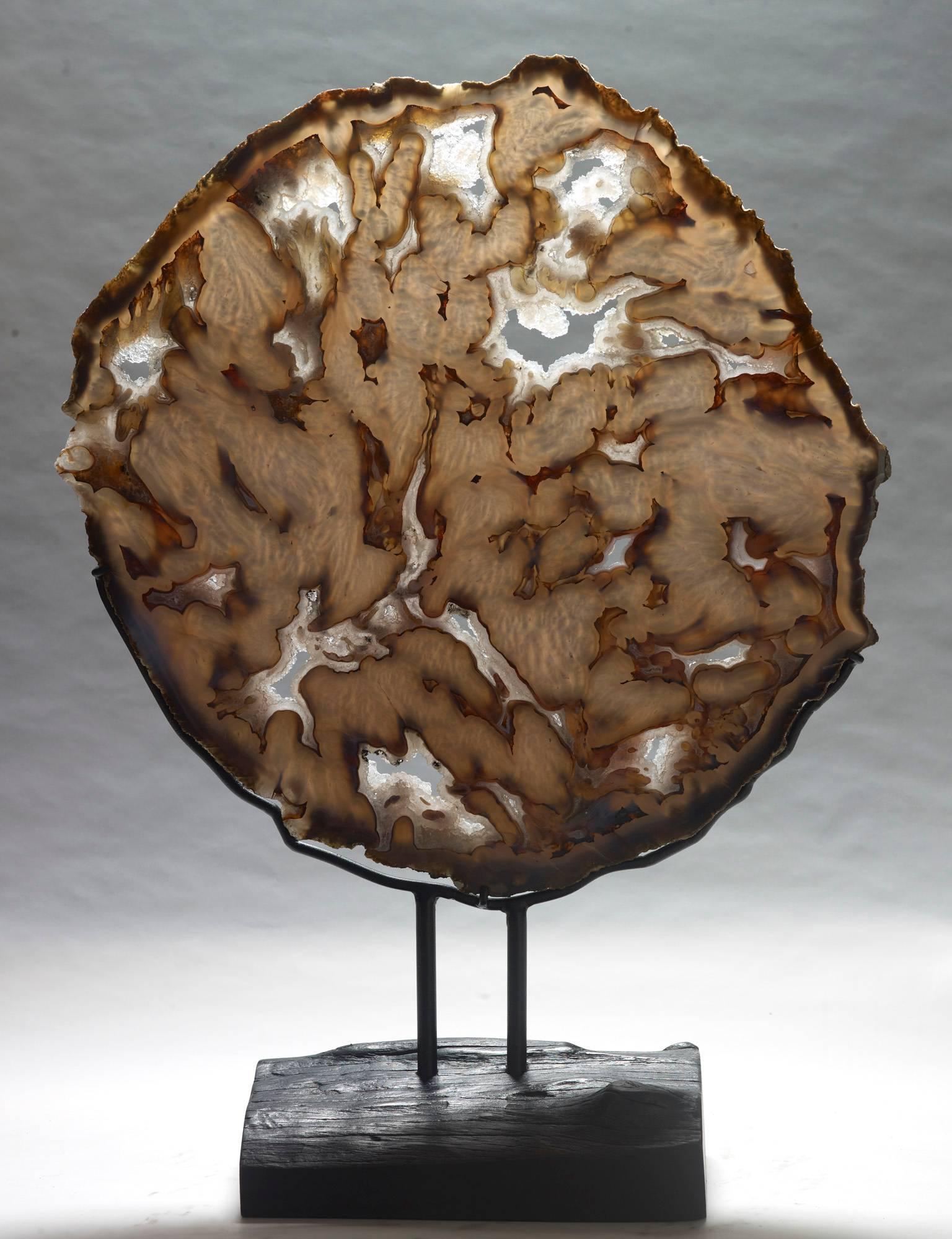 An exceptionally large slice of agate, polished on both sides. It is rare to find such a large piece without significant cracks or damage. Rio Grande do Sul, Brazil. Measures: 74 x 54 x 20 with stand.