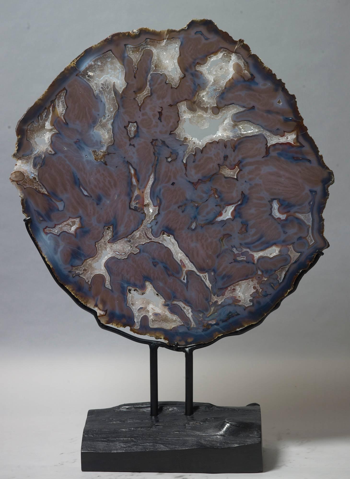 large agate slice on stand