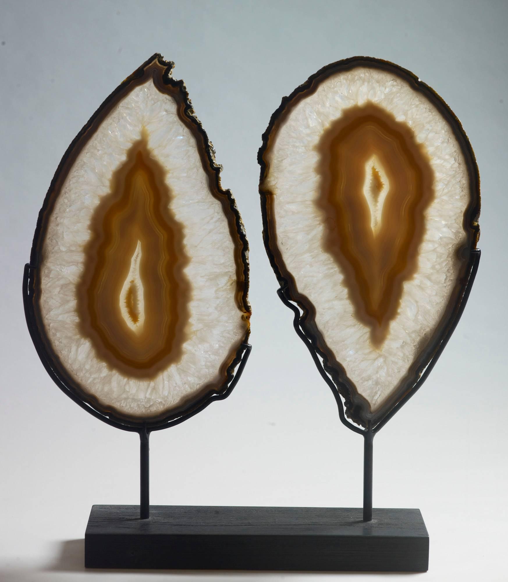 “Yin Yang” pair of polished agate slices. Rio Grande do Sul, Brazil. Measures: Color differences in the images are the result of back lighting. 45 x 40 x 10 with stand. 