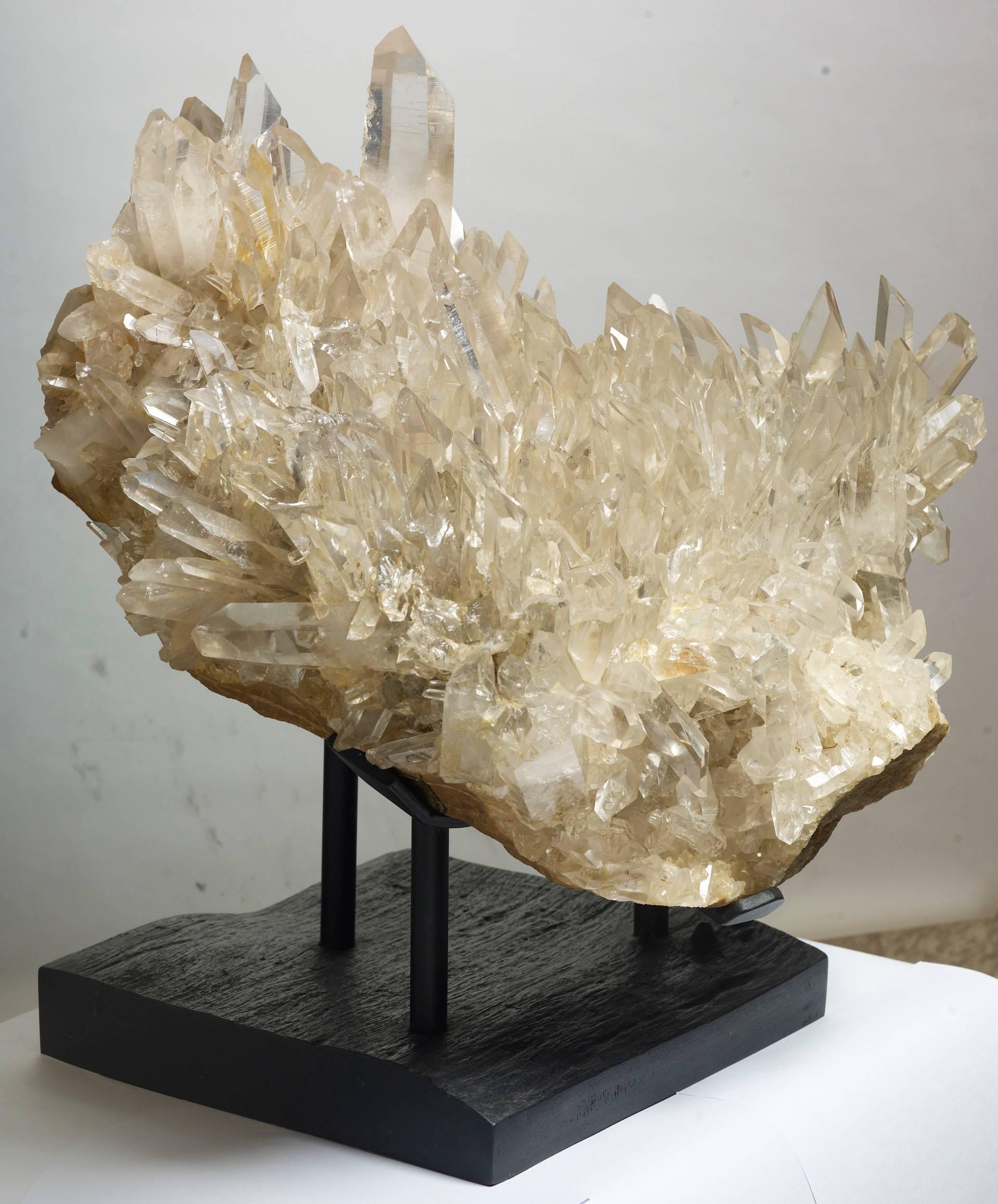 Large and fine cluster of “rock crystal” clear quartz from one of the most desirable locations; Hot Springs, Arkansas, USA.  Truly a very impressive specimen. Measure: 66 x 63 x 58 with stand.