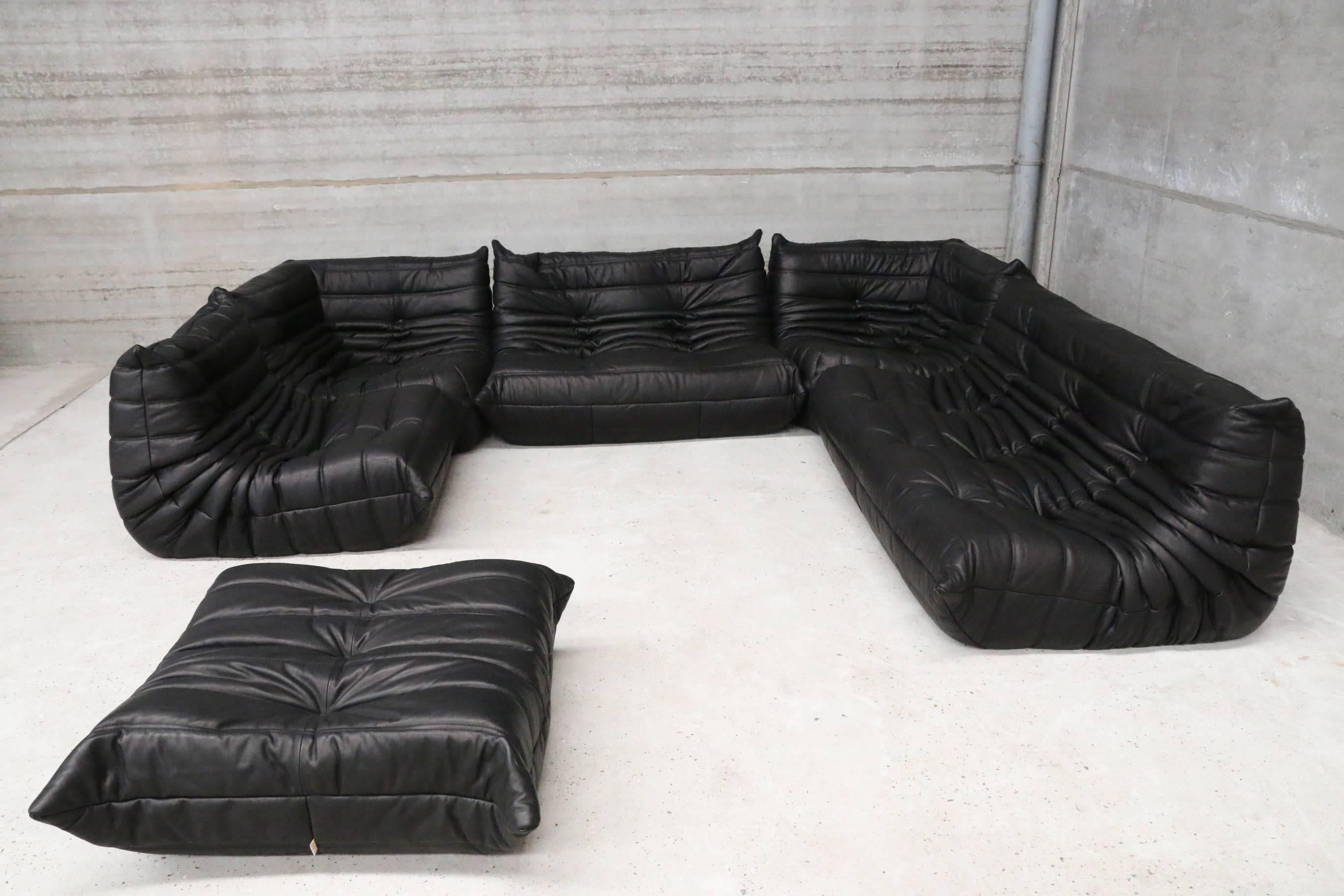 This iconic lounge set designed by Michel Ducaroy for Ligne Roset was re-upholstered in our full grain black colored leather. 
This leather will age beautifully. 
The set contains
Three-seat: W 174cm
Two-seat: W 131cm
One seat: W 87cm
Two corner: W