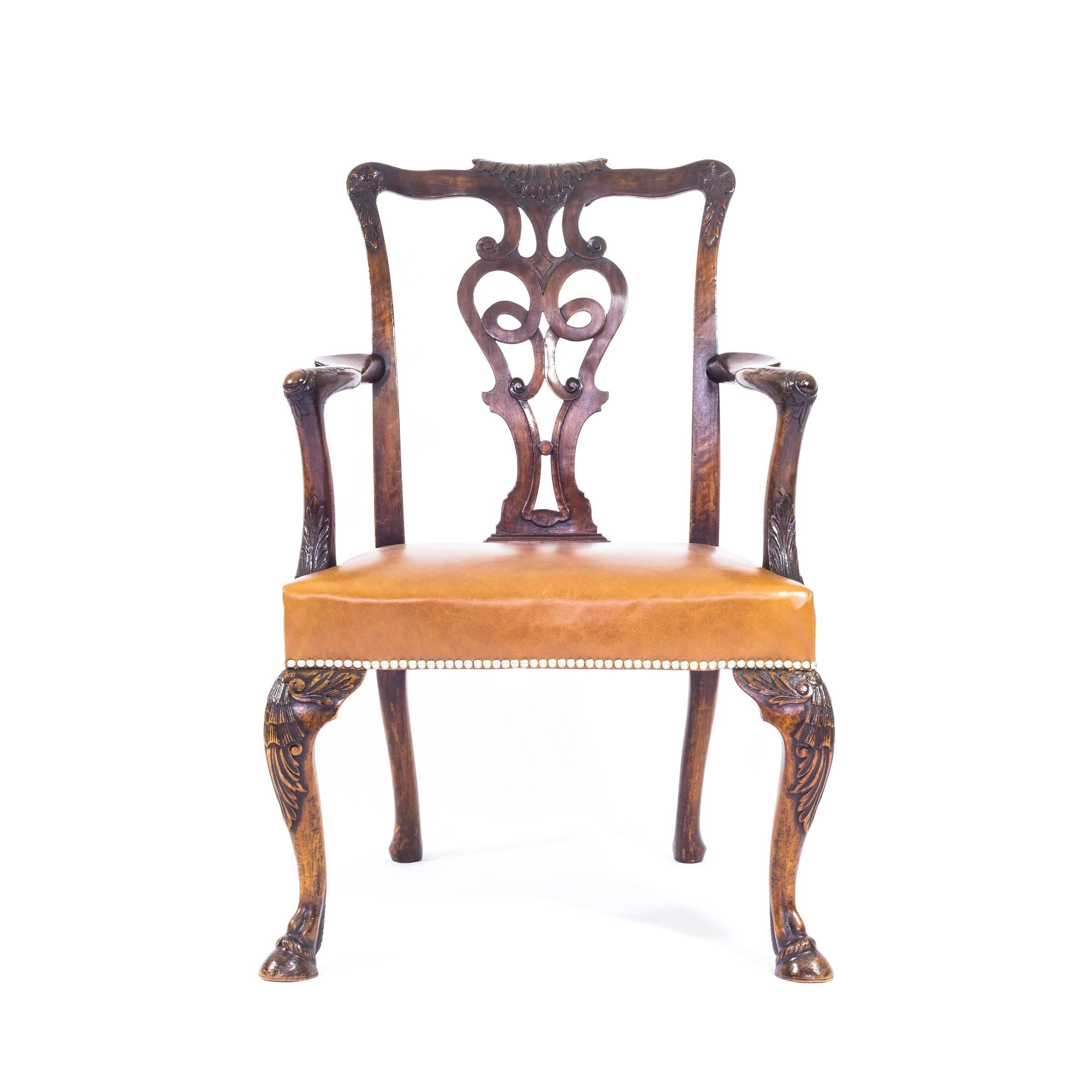 Unlike the majority of mass-produced Georgian revival chairs, this bespoke armchair was commissioned by Lord Rufus Daniel Isaacs, the Viceroy of India in 1921-1926. Copied to match the original mid-18th century Irish chairs, this exceptional