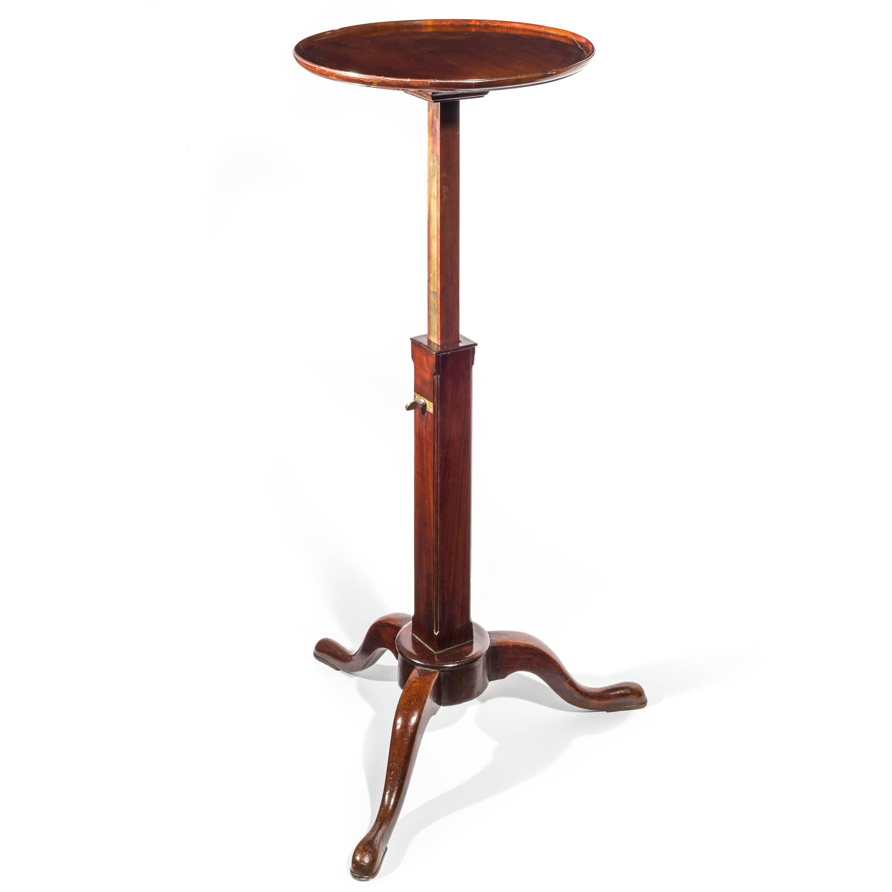 A rare and unusual George II Chippendale period telescopic table or stand in mahogany,

Scottish, circa 1754.

The circular dished top above an extending square column of the telescopic action, having moulded corners and raised on a tripod base with