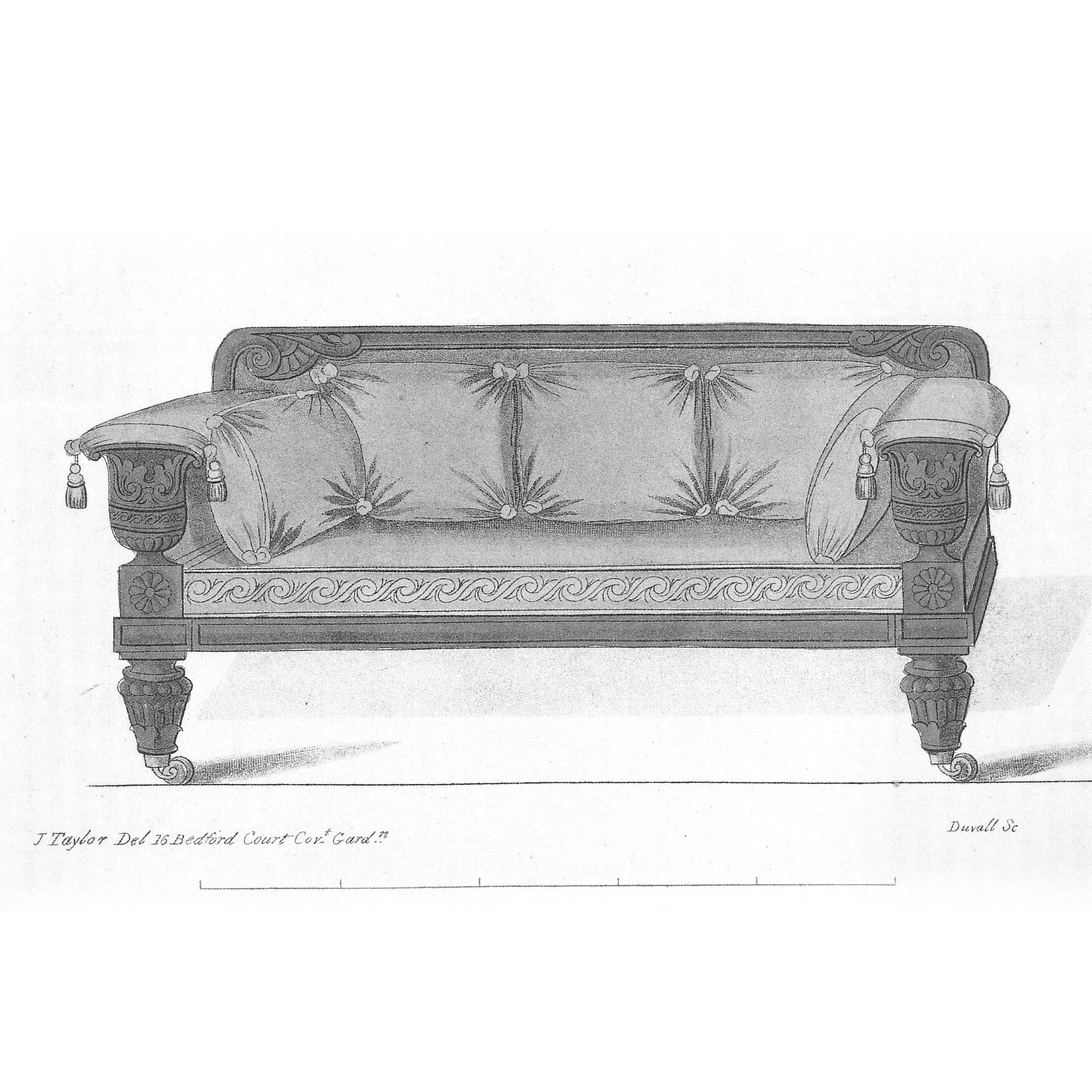 A very fine English Regency period carved mahogany sofa in the Grecian taste, after a design by John Taylor, circa 1820.

The panelled top rail with acanthus-wrapped scroll ends, above a padded back and seat, above the reeded Grecian urn-shaped
