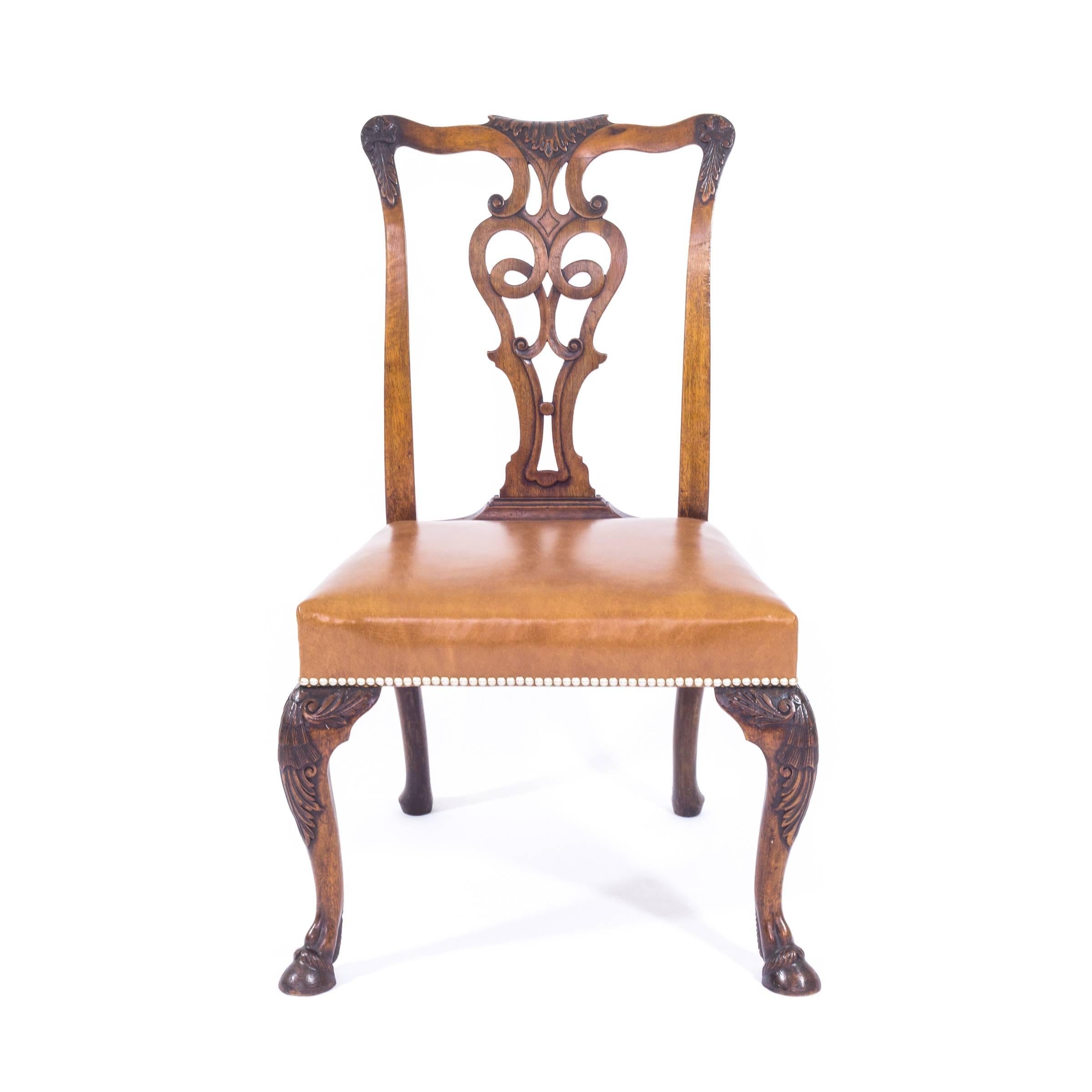 Unlike the majority of mass-produced Georgian revival chairs, this bespoke set was commissioned by Lord Rufus Daniel Isaacs, the Viceroy of India in 1921-1926. Copied to match the original mid-18th century Irish chairs, this exceptional set stands