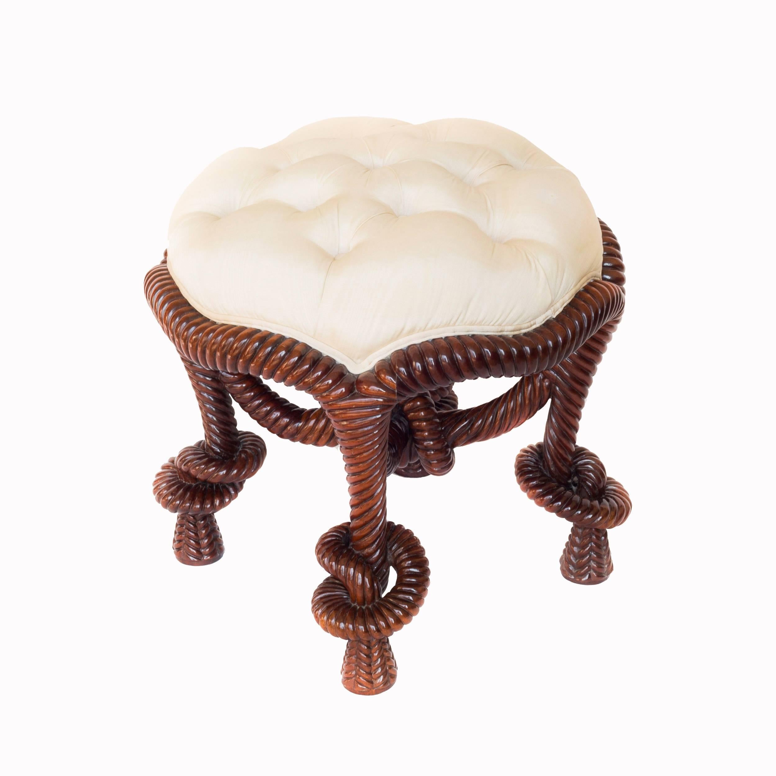 A fabulous French Napoleon III style mahogany rope-twist ladies' dressing stool, after the design by A.M.E. Fournier, 
French, 20th century.

With cream moire silk covered deep-button tufted seat over profusely carved and pierced mahogany frame,
