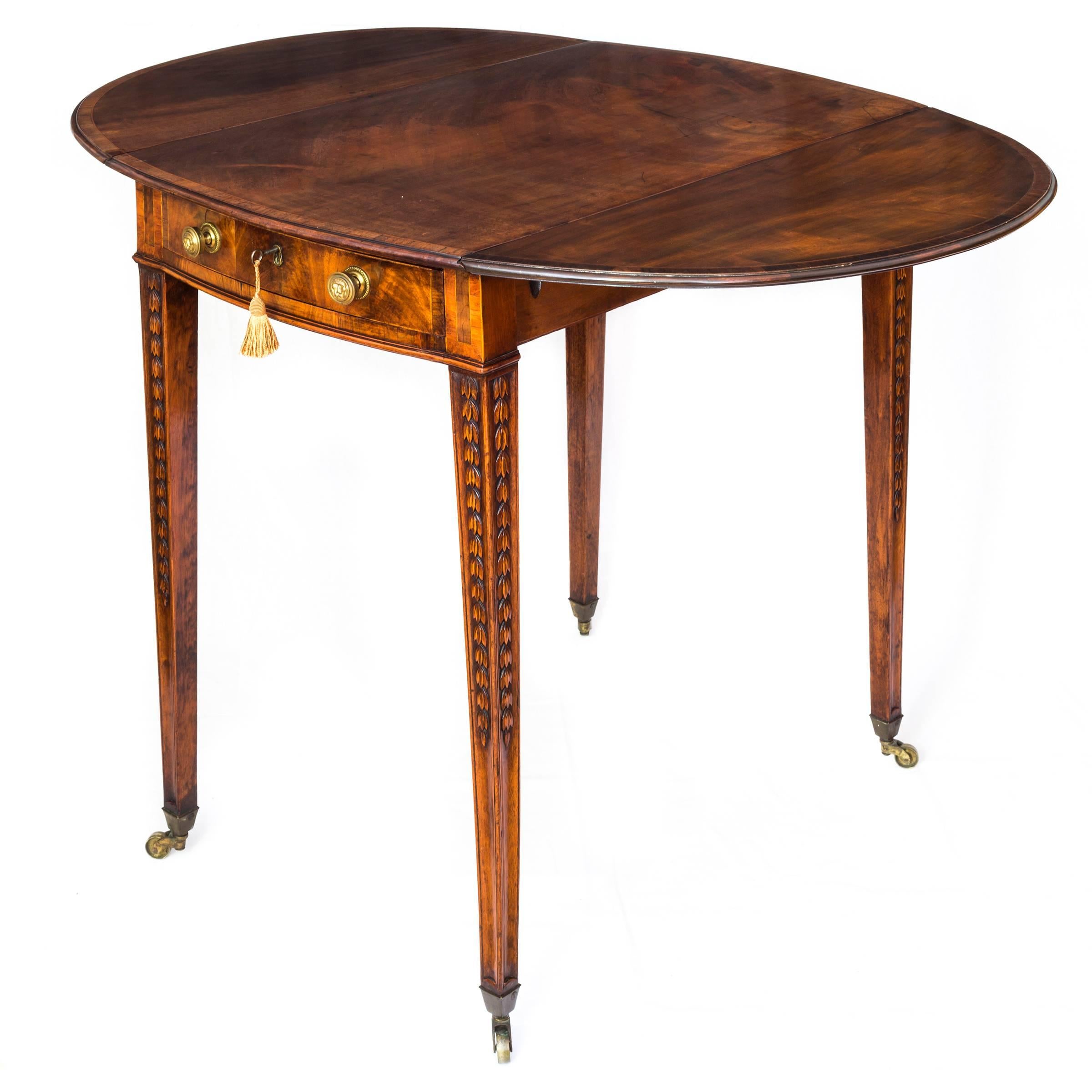 A very fine late 18th century Adam period flame mahogany veneered and tulipwood crossbanded Pembroke table of oval form,

England, circa 1780.

The rectangular and bow-shaped at either side solid mahogany top with two rounded flaps, all veneered