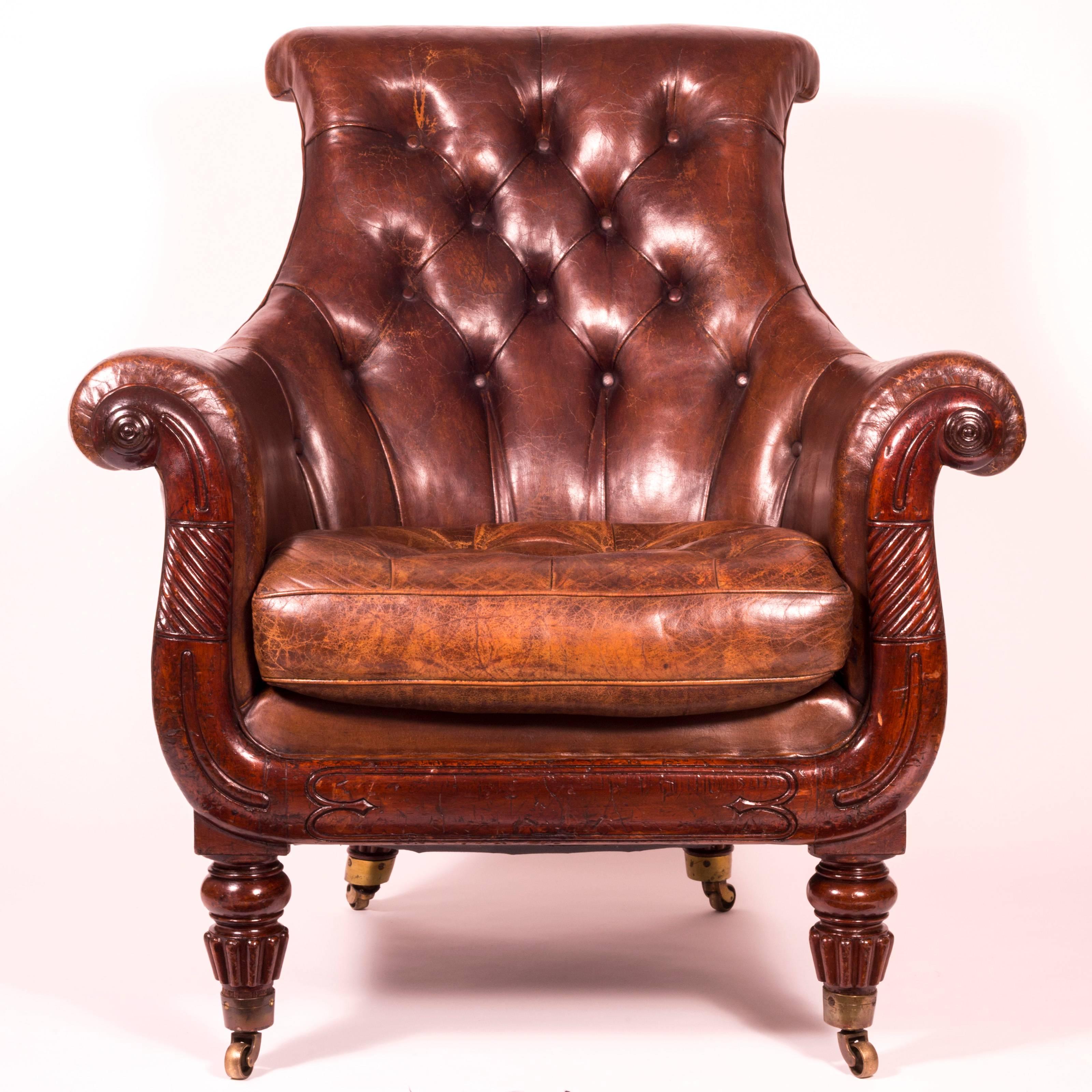 A stunning Regency period mahogany library bergère armchair of generous proportions, firmly attributed to Gillows of Lancaster and London,

England, circa 1820

The scrolled and buttoned padded back, within the scrolled arms, over a buttoned loose