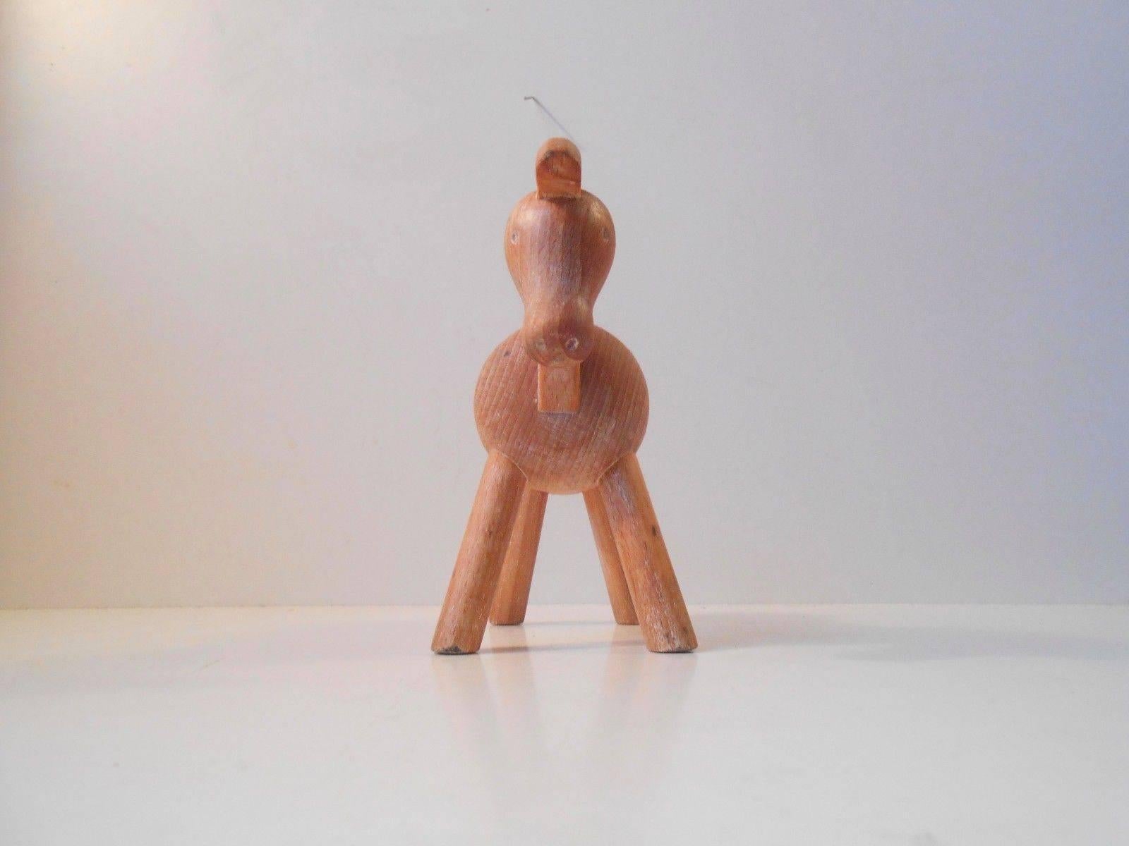 Measurement and info:

Type: Wooden horse toy/figure.

Material: Beech.

Color: Beech with natural patina and aging.

Design/maker: Kay Bojesen.

Origin: Denmark.

Period: 1950s (1935).

Height: Approximately 14 cm (5.6