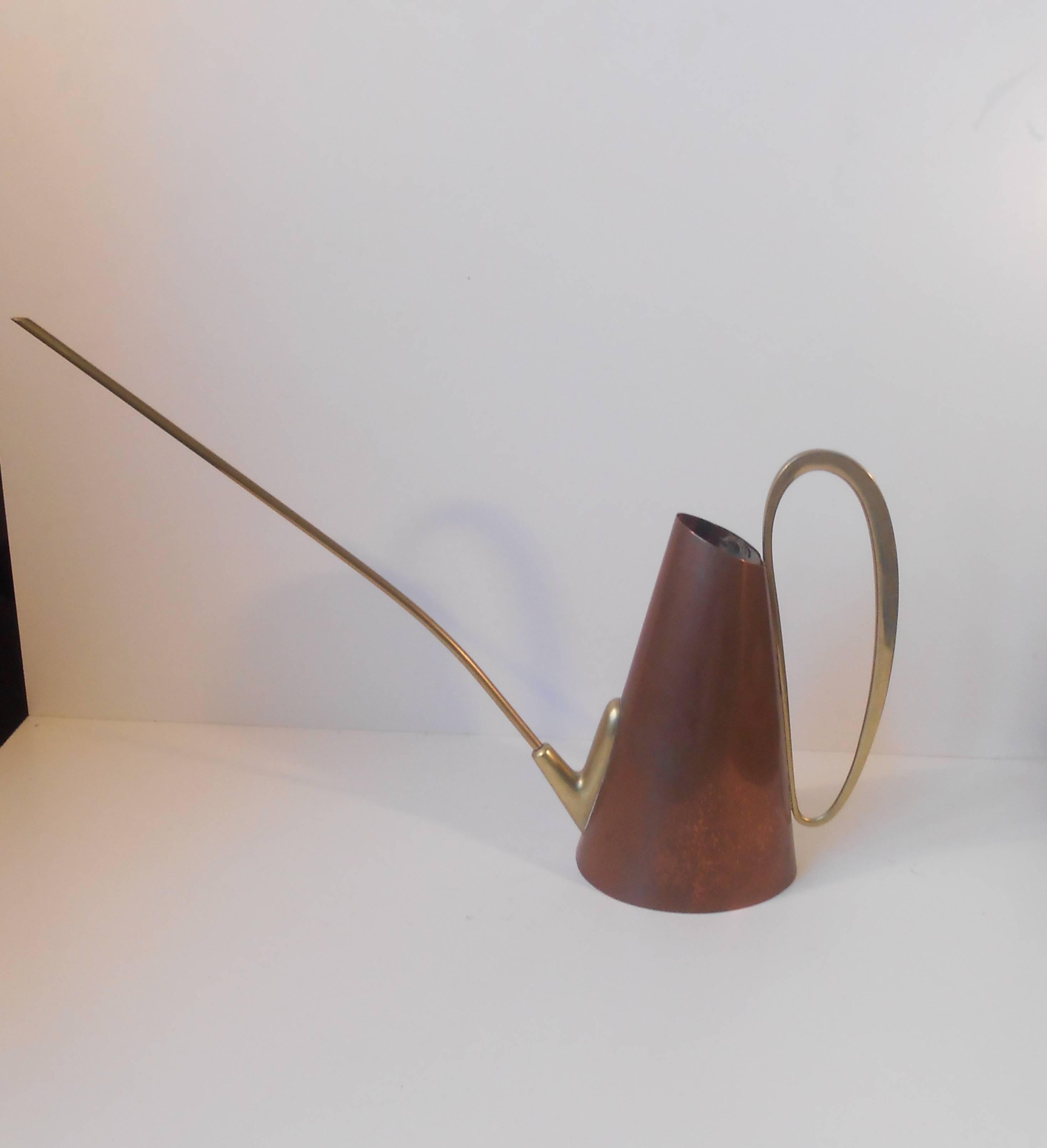 Beautiful and simple crafted watering can made by Illums Bolighus Denmark, circa 1950. Measurement ('body' without handle): 10 inches (25 cm). Capacity circa 1 liter water.