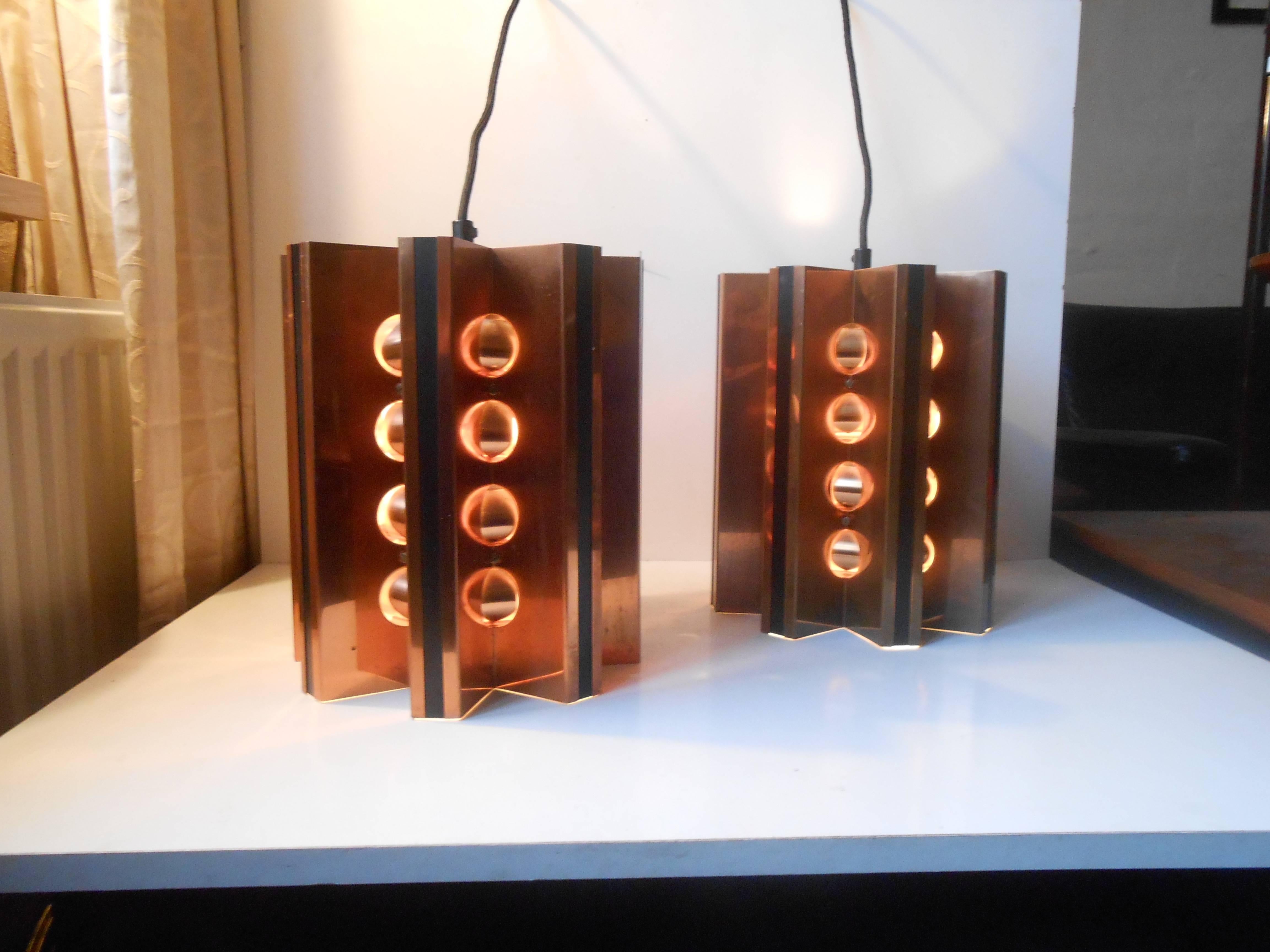 A pair of solid copper star-shaped pendant lights by danish Architect Werner Schou. Splendid condition with very light ware. Measurements: H 11 inches (28 cm), D 8.5 inches (22 cm).