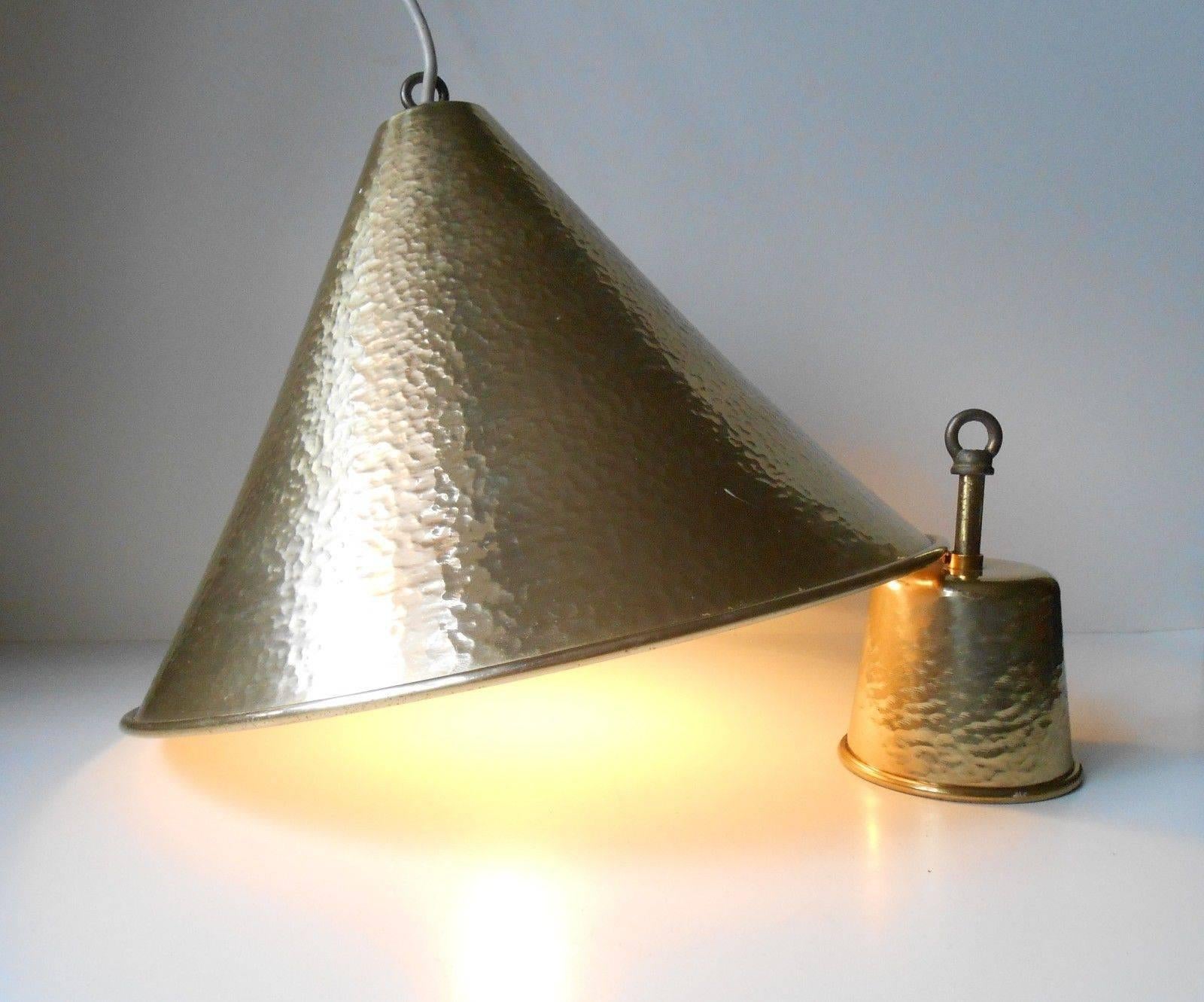 Conical Mid-Century ceiling light and matching canopy i solid hammered brass. It was manufactured in Denmark during the 1960s by Kobber Kompagniet.