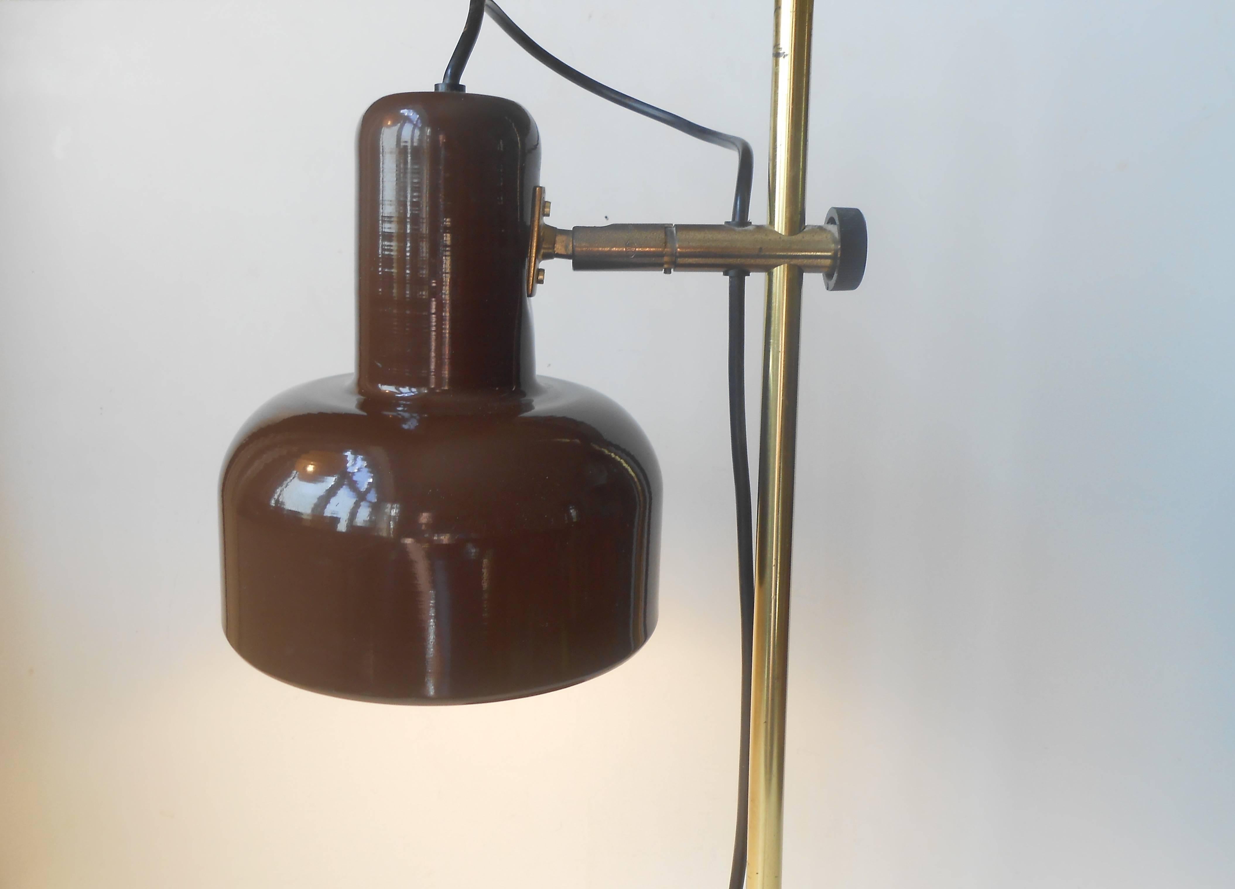 Fully adjustable table lamp designed by Jo Hammerborg and manufactured by Fog & Mørup in the mid-1970s. Solid brass frame and shade-arm. Chocolate brown powder coated base and shade. Measurements: H 53 cm (21 inches),
D shade/base: 15 cm (6 inches).