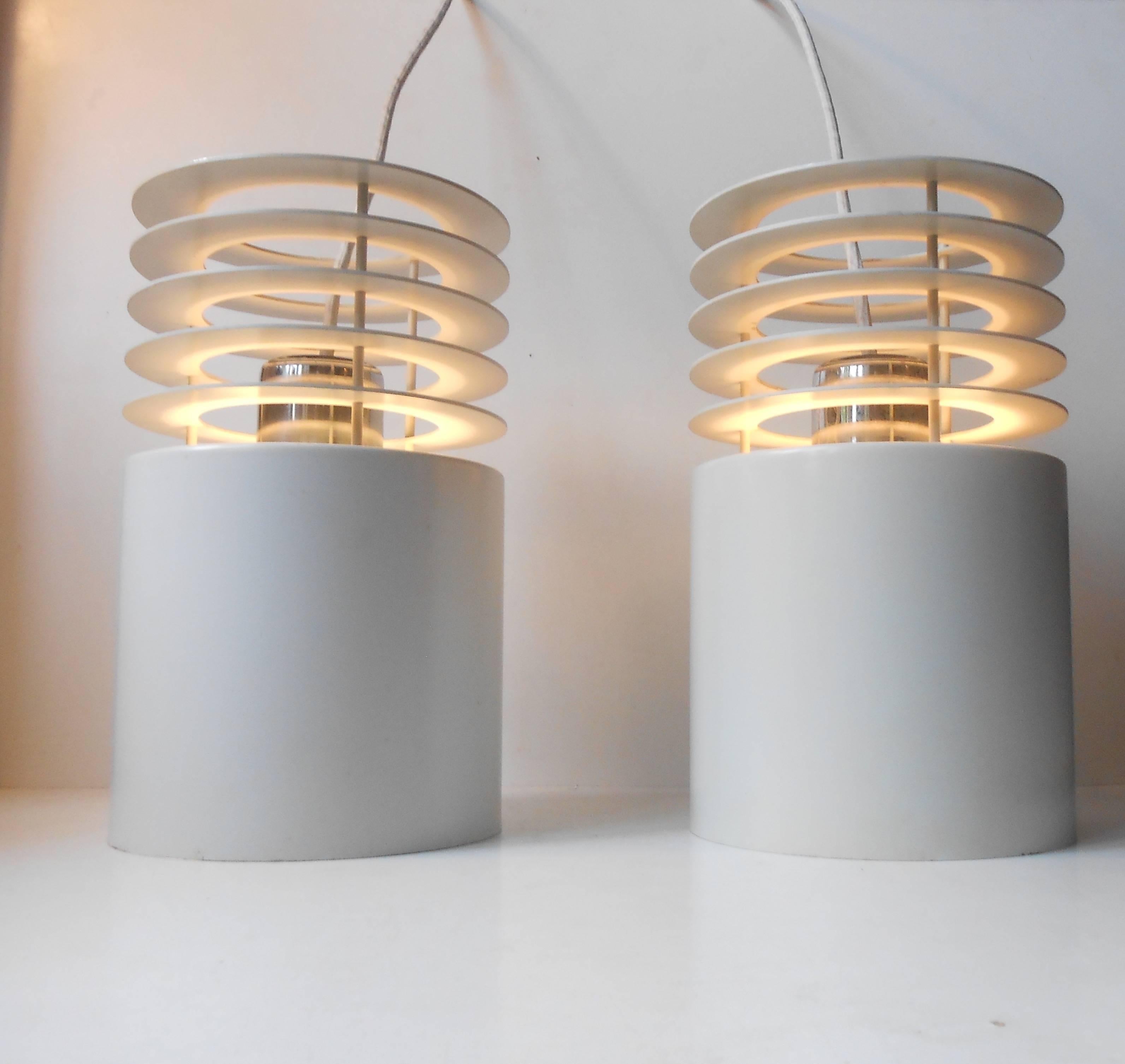 Matching pair of 'Hydra 1' pendant lamps designed by Jo Hammerborg and manufactured by the Danish Company Fog & Mørup in the 1970s. These have been hanging together and show similar ware and light patina. Measurements: H: 13 inches (33 cm), D: 6.8