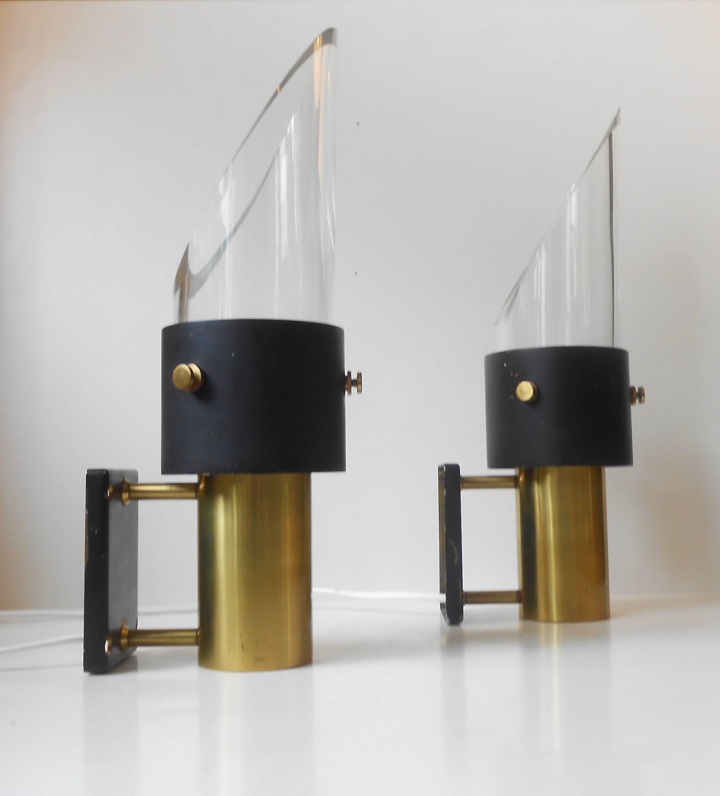 Constructed of partially painted solid brass and thick tubular Orrefors crystal, these wall lights demands attention. They were manufactured in a very limited quantity by Lyfa, Denmark in collaboration with Swedish Orrefors. The model is called