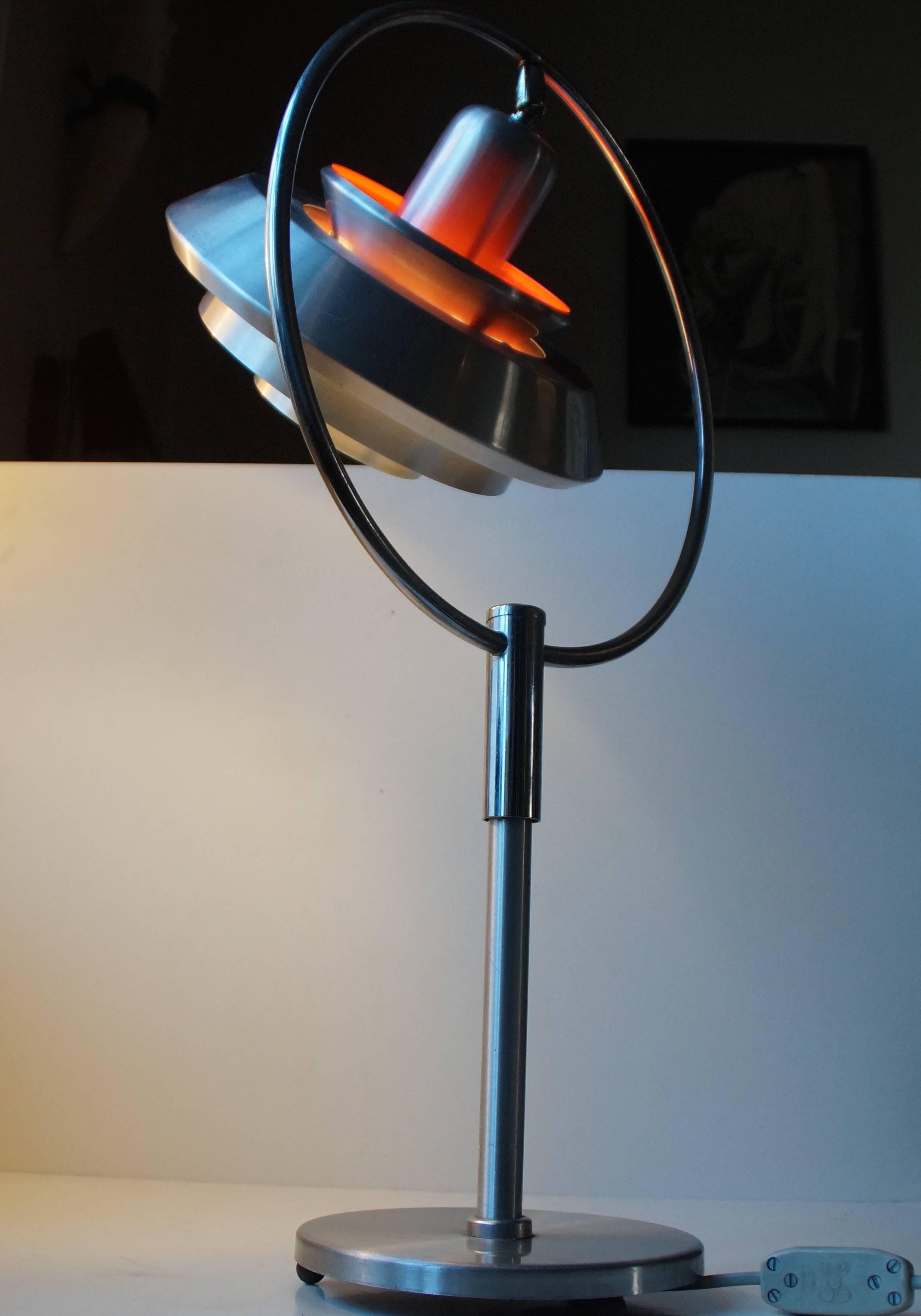 Brushed aluminium and chromed steel table light - desk lamp designed by Sigurd Lindkvist Alias Carl Thore. Manufactured by Granhaga Metalindustri in the mid-1960s. The shade is adjustable to both sides via the orbit ring. Measurements: H: 20