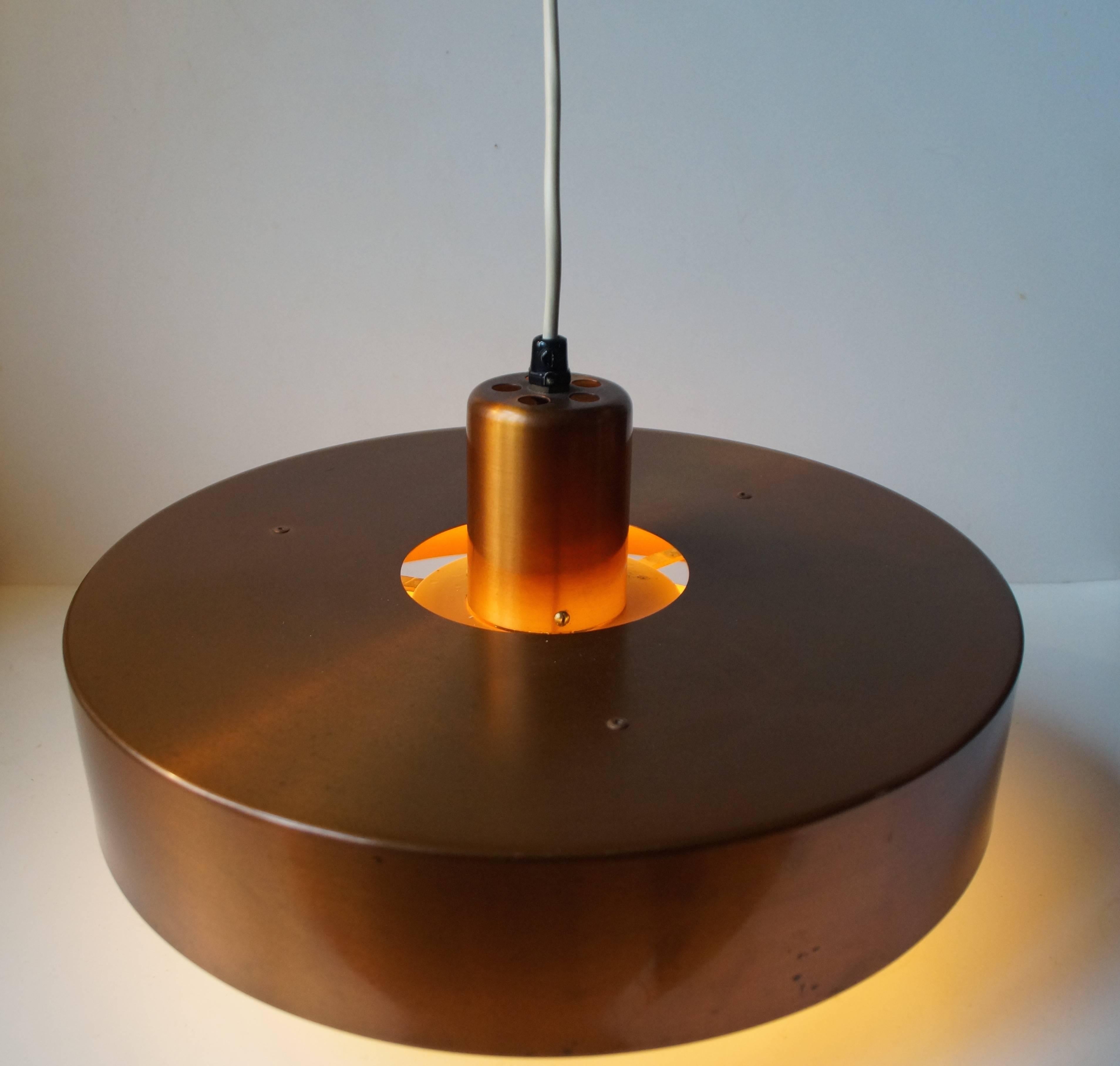 This solid copper pendant lamp was designed by Johannes Hammerborg for Fog & Mørup, Denmark and released as 'Roulet' in the early 1960s. It is one of Hammerborg earliest designs. Nice vintage condition with light ware and even patina to the