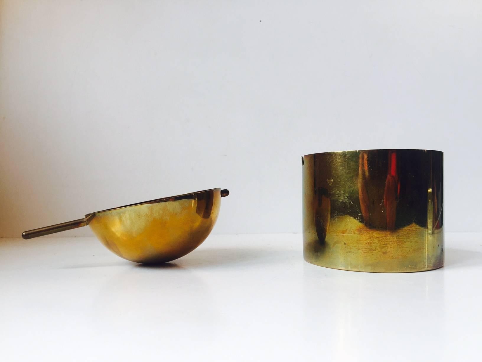This brass version of the Cylinda-line ashtray was designed by Arne Jacobsen and manufactured by Stelton in a limited run in 1967. This, the large version or cigar ashtray, is by far the rarest of the two sizes it came in. The nice thing about it is
