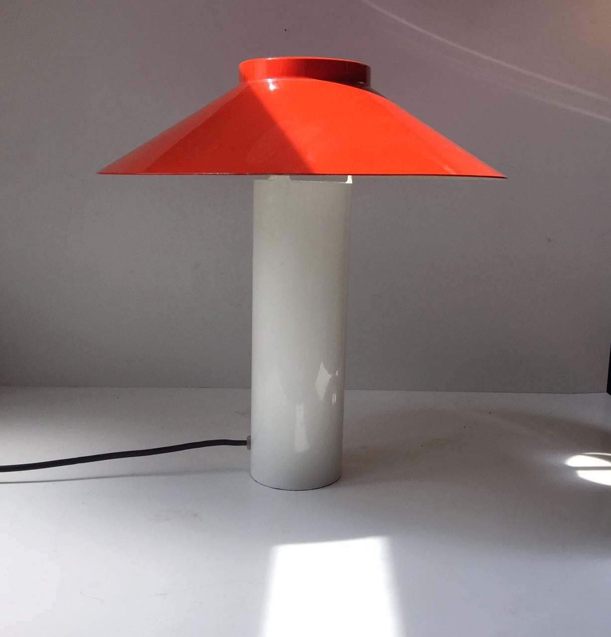 This rare modernistic and minimalistic metal table lamp was designed by Hans Schwazer in 1976. Its was manufactured by Holmegaard only in a few years.
