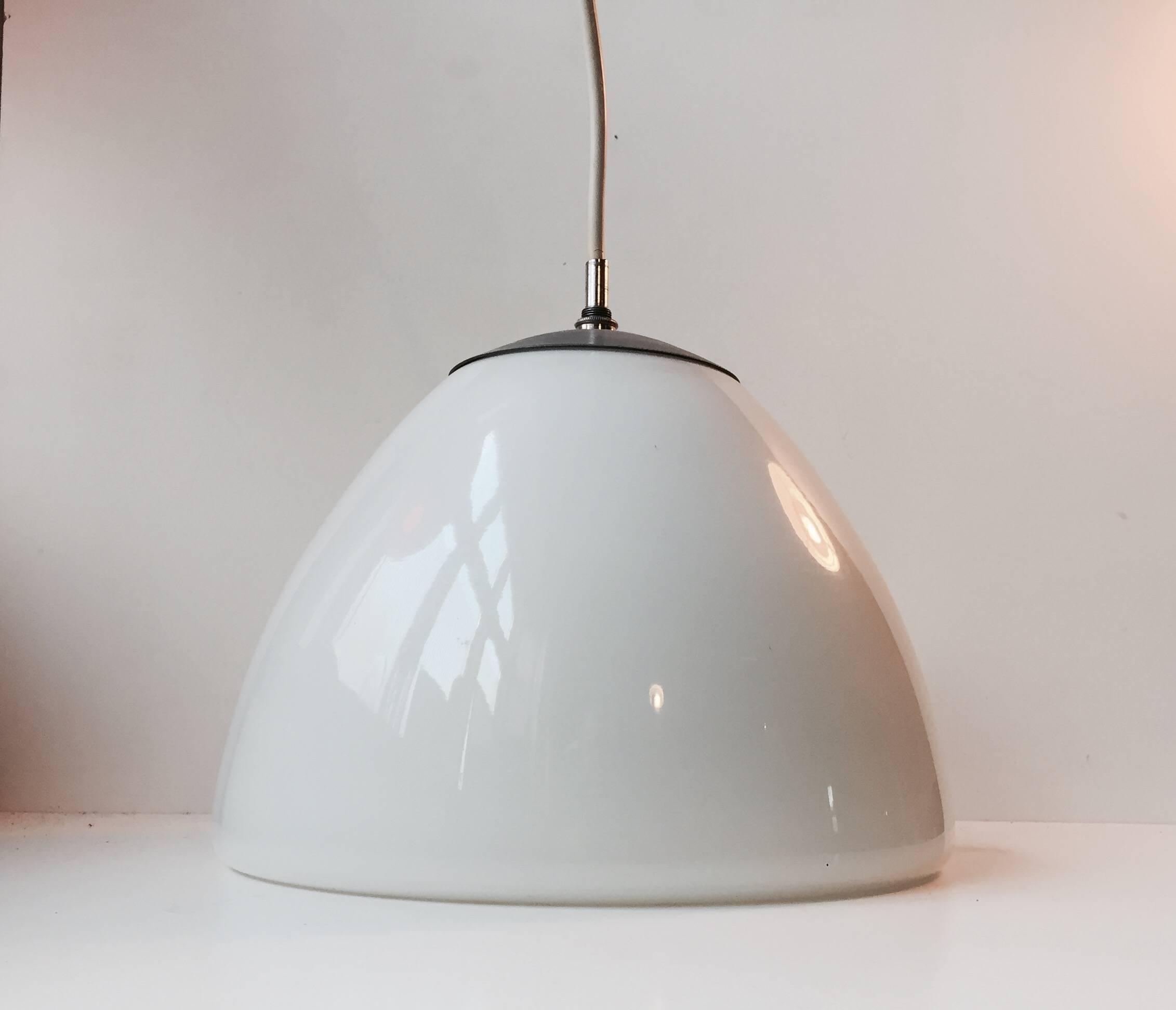 Art Deco styled white opal glass pendant lamp designed and manufactured by Louis Poulsen in Denmark during the 1960s. The design of this Light can possibly be related to Vilhelm Lauritzen but this remains unsudden.