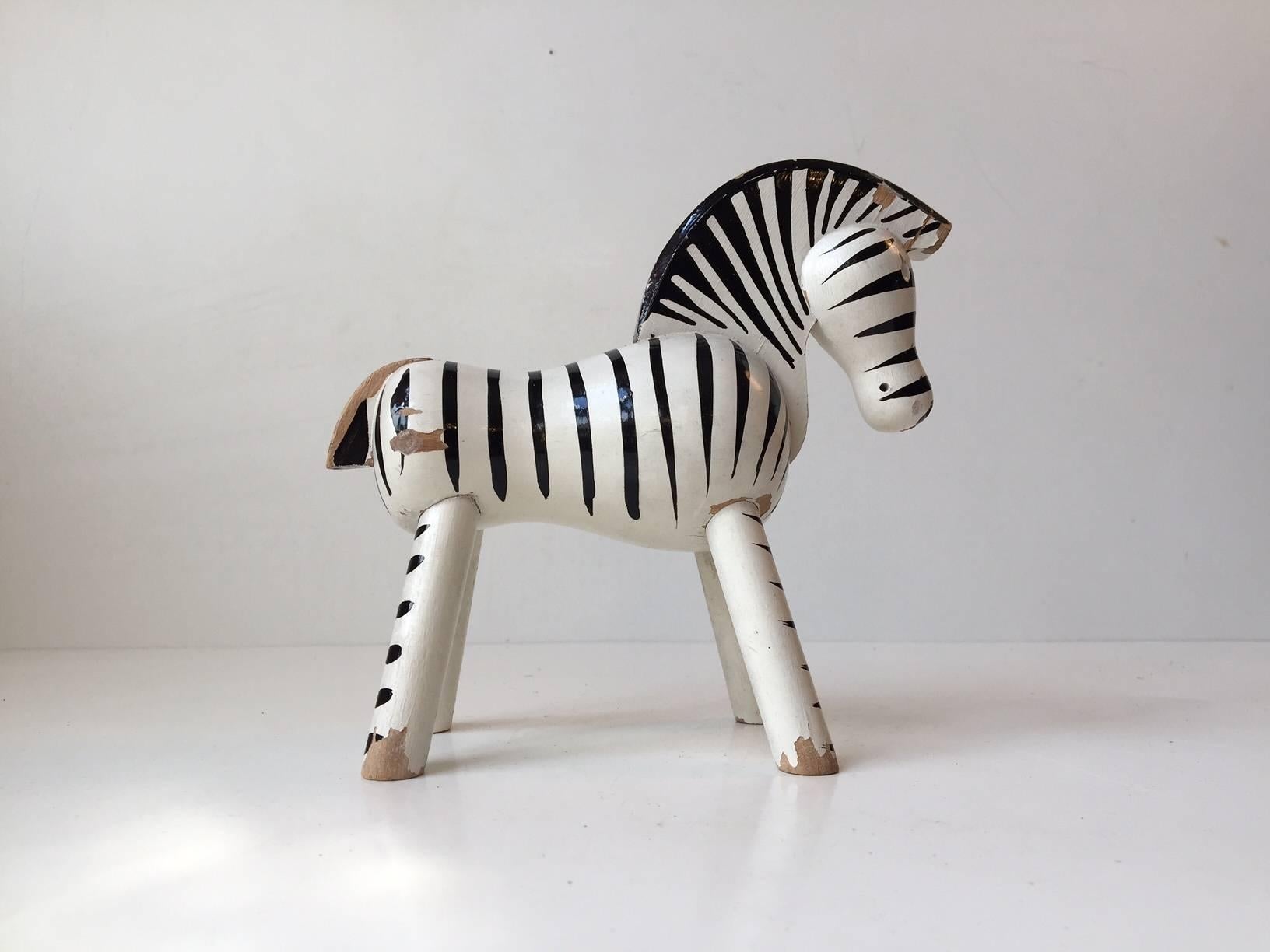 Wooden Toy Zebra Figurine. Material: Beech. Color: White and black.
Design: Kay Bojesen. Origin: Denmark. Period: Manufactured in the 1950s (Designed in 1935). Measurements: Height approximately 14 cm (5.6 inch). Length: Approximately 15 cm (6