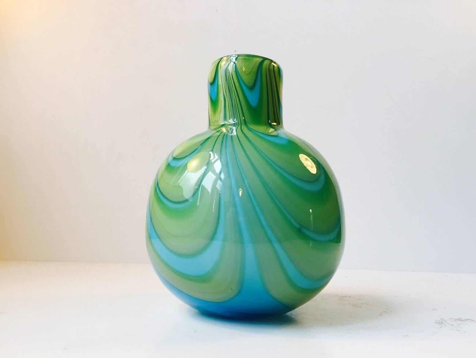 This thick and heavy vase with bon-bon stripes was designed by Carlo Moretti and manufactured in Murano, Italy during the 1970s.